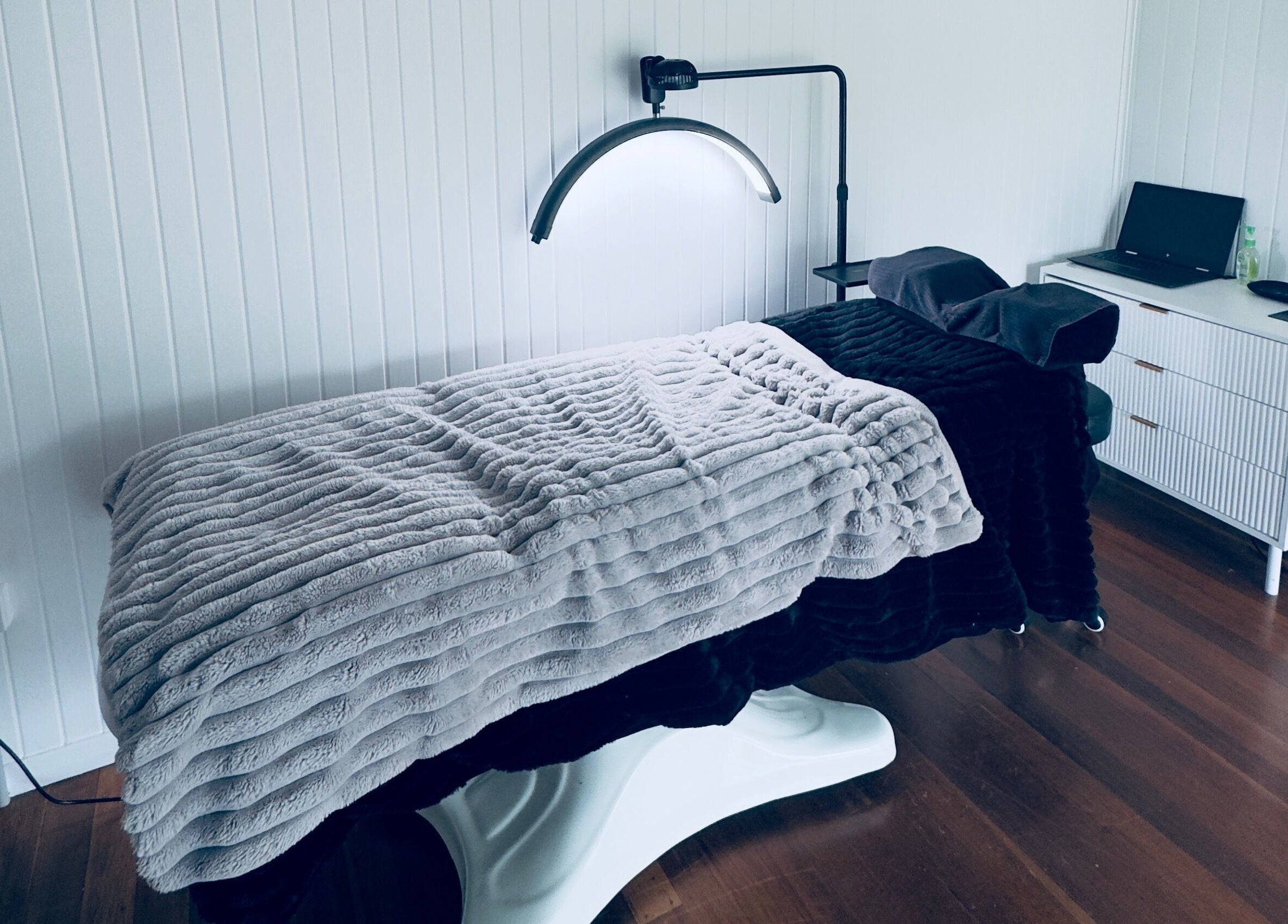 Cozy massage room at Finessed By Cloe in Berserker, Queensland, AU with warm-toned decor and soothing ambiance.