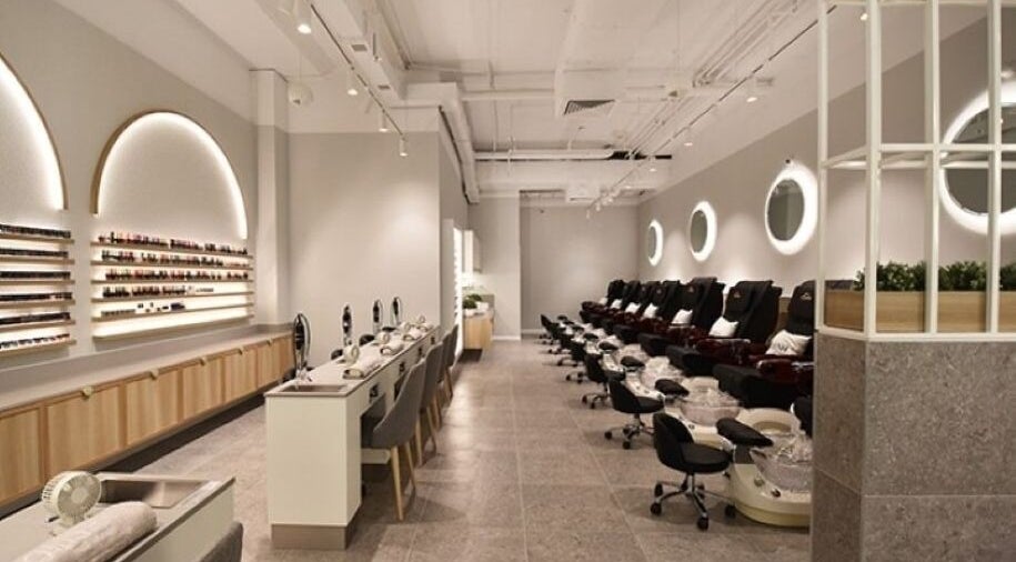 Elegant nail care area at POLISH INDOOROOPILLY, Indooroopilly, Queensland, AU with chic seating and modern decor.
