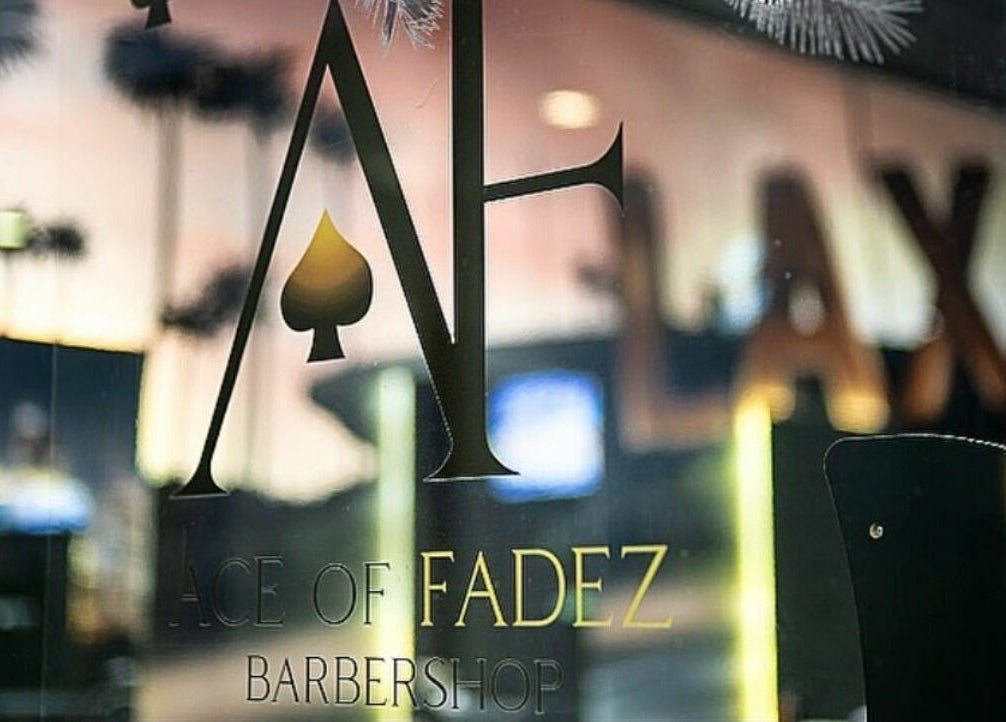 ACE OF FADEZ LANE COVE window sign with palm tree reflections in Lane Cove, New South Wales, AU.