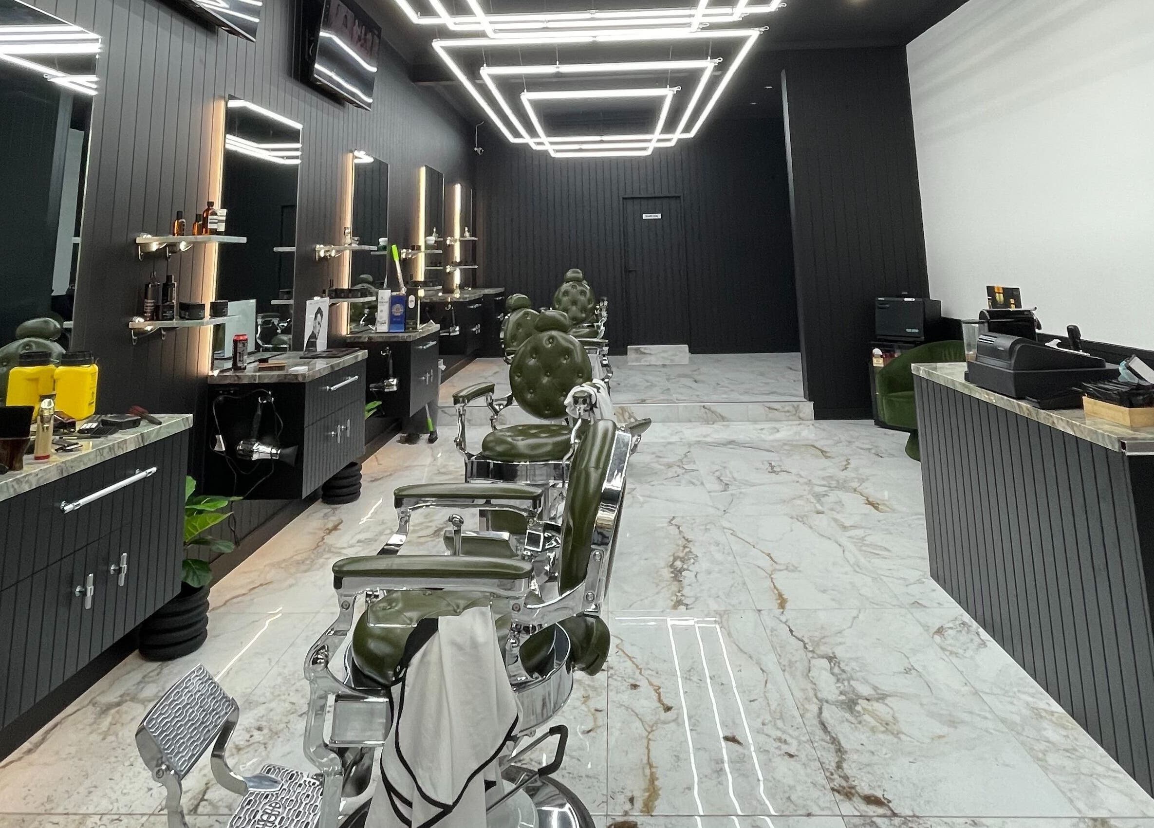 Modern interior of ACE OF FADEZ CROWS NEST, Crows Nest, New South Wales, AU showing sleek barber chairs and stylish decor.