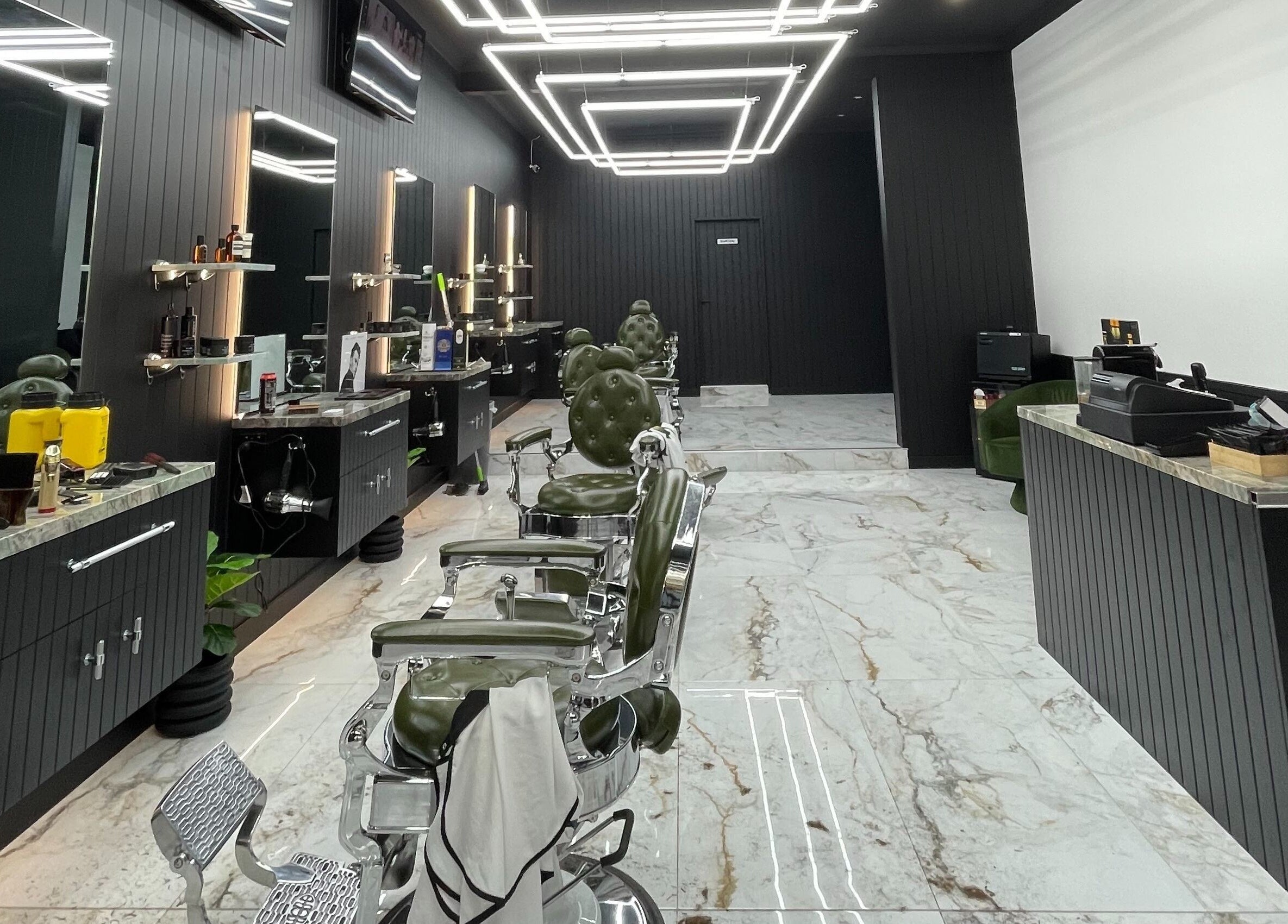 Modern interior of ACE OF FADEZ CROWS NEST, Crows Nest, New South Wales, AU showing sleek barber chairs and stylish decor.