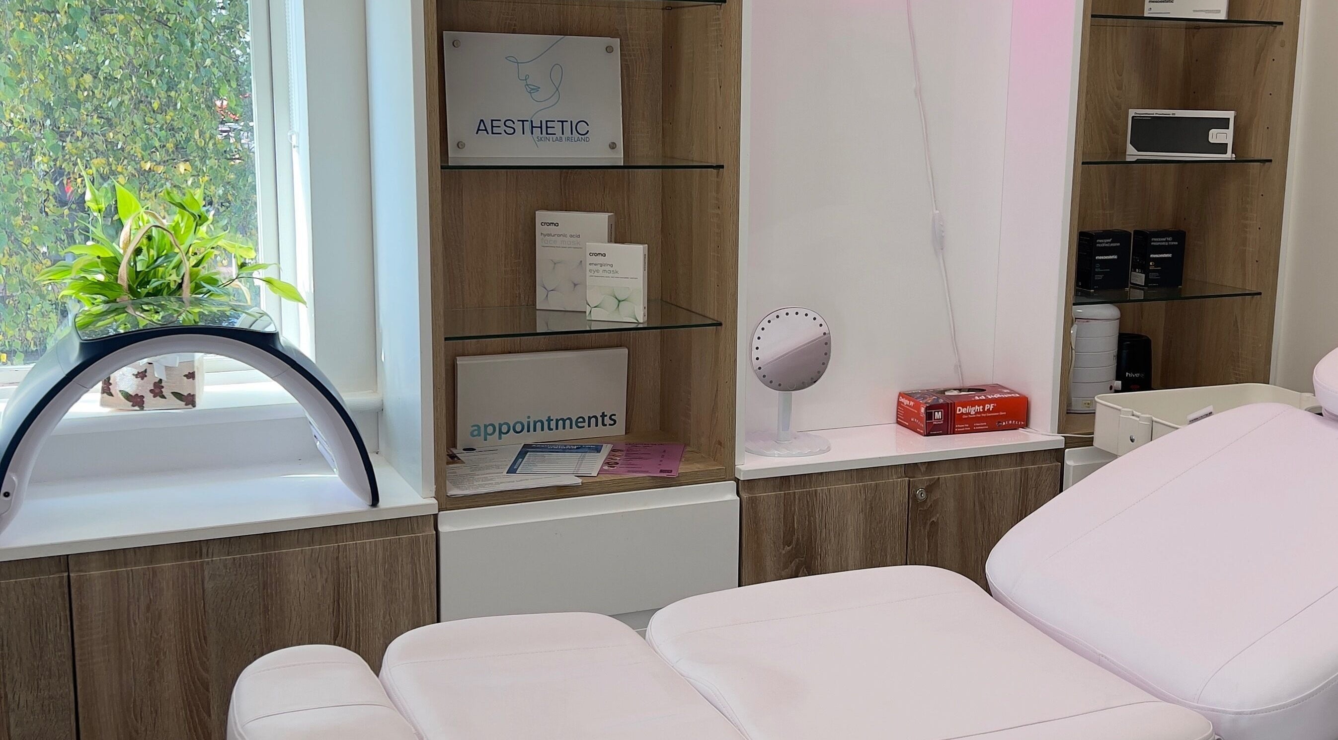 Relaxing treatment room at Aesthetic Skin Lab Ireland, Dublin, Dublin 15, IE with cozy seating and modern decor.