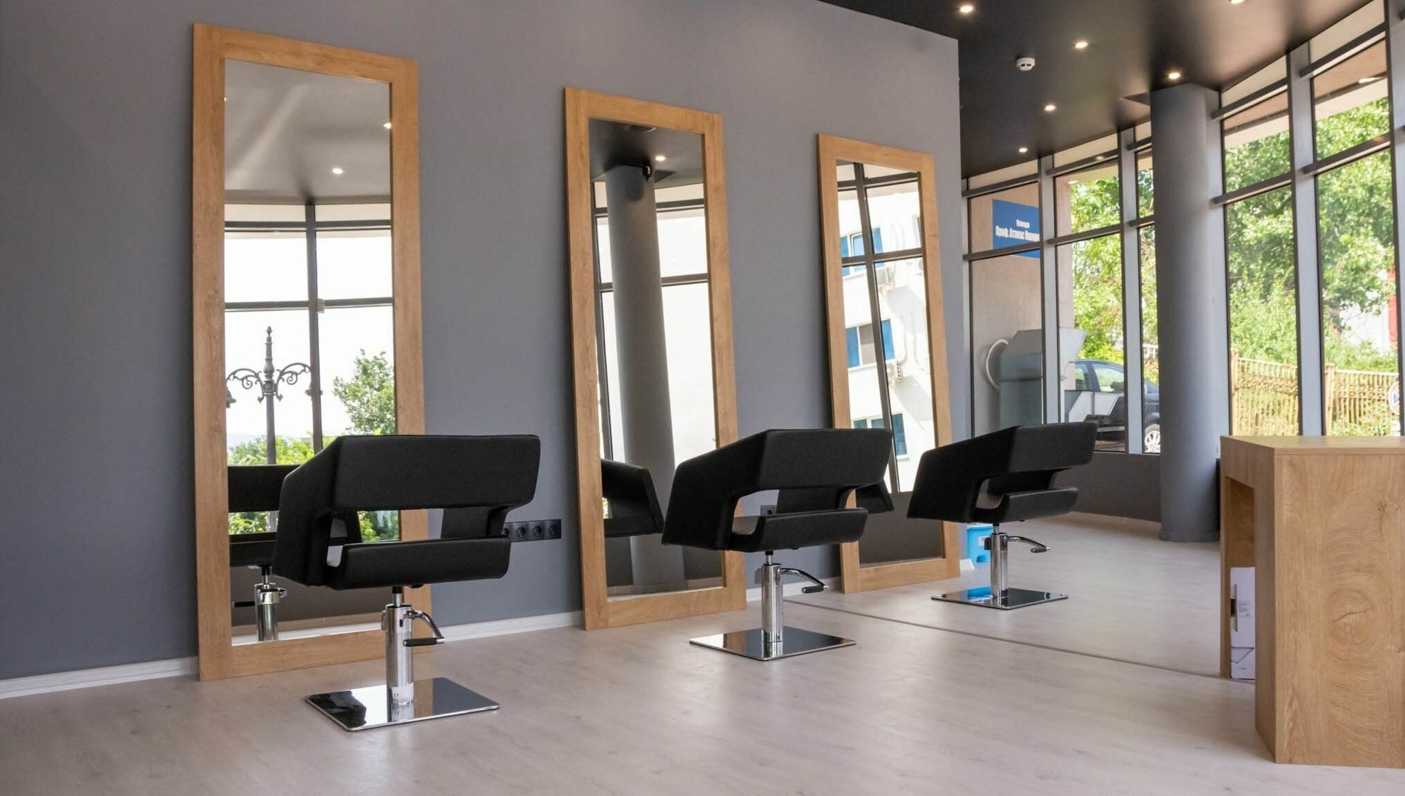 Stylish interior of Salon Inspire, kv. Studentski Grad, София, BG with chic mirrors and seating.
