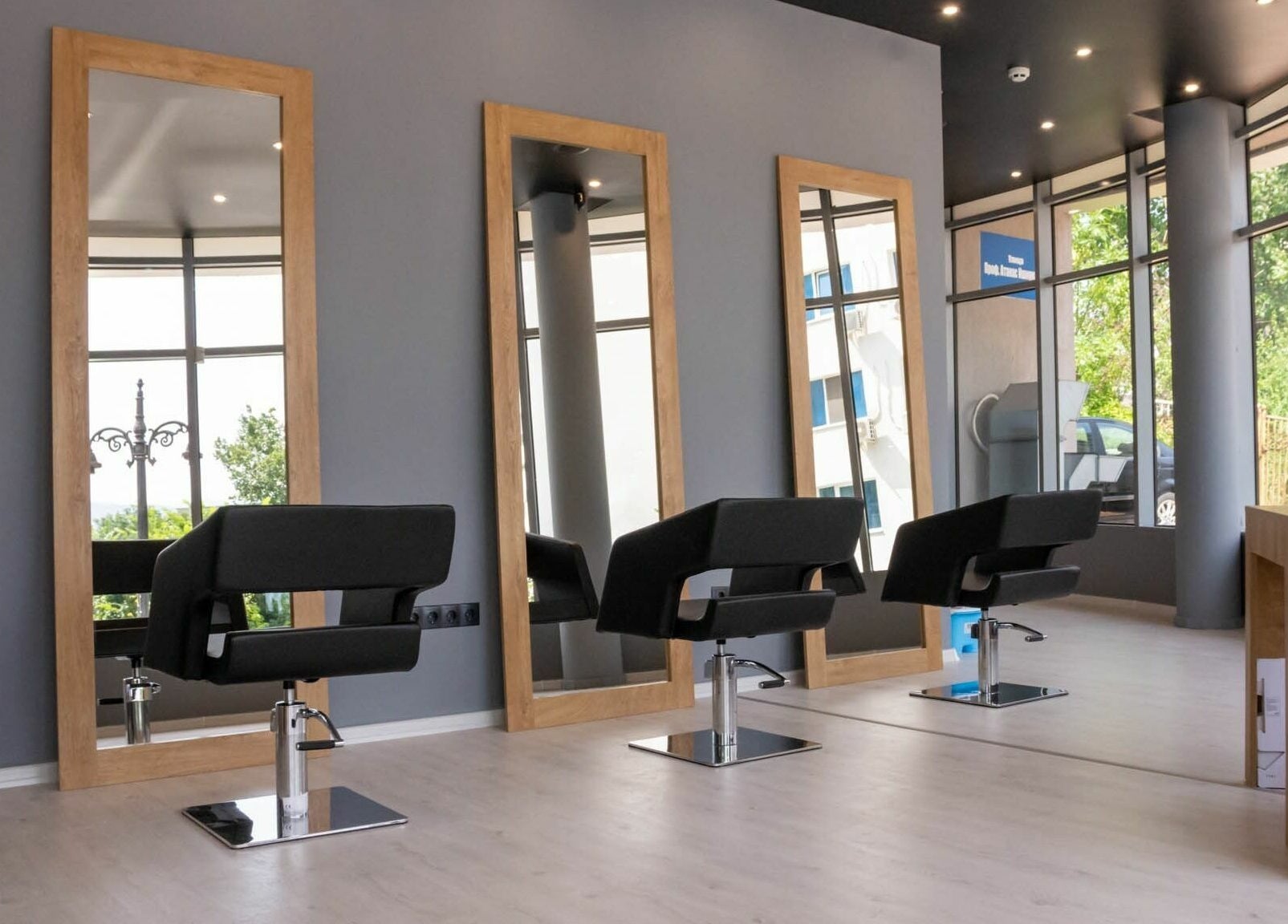 Stylish interior of Salon Inspire, kv. Studentski Grad, София, BG with chic mirrors and seating.
