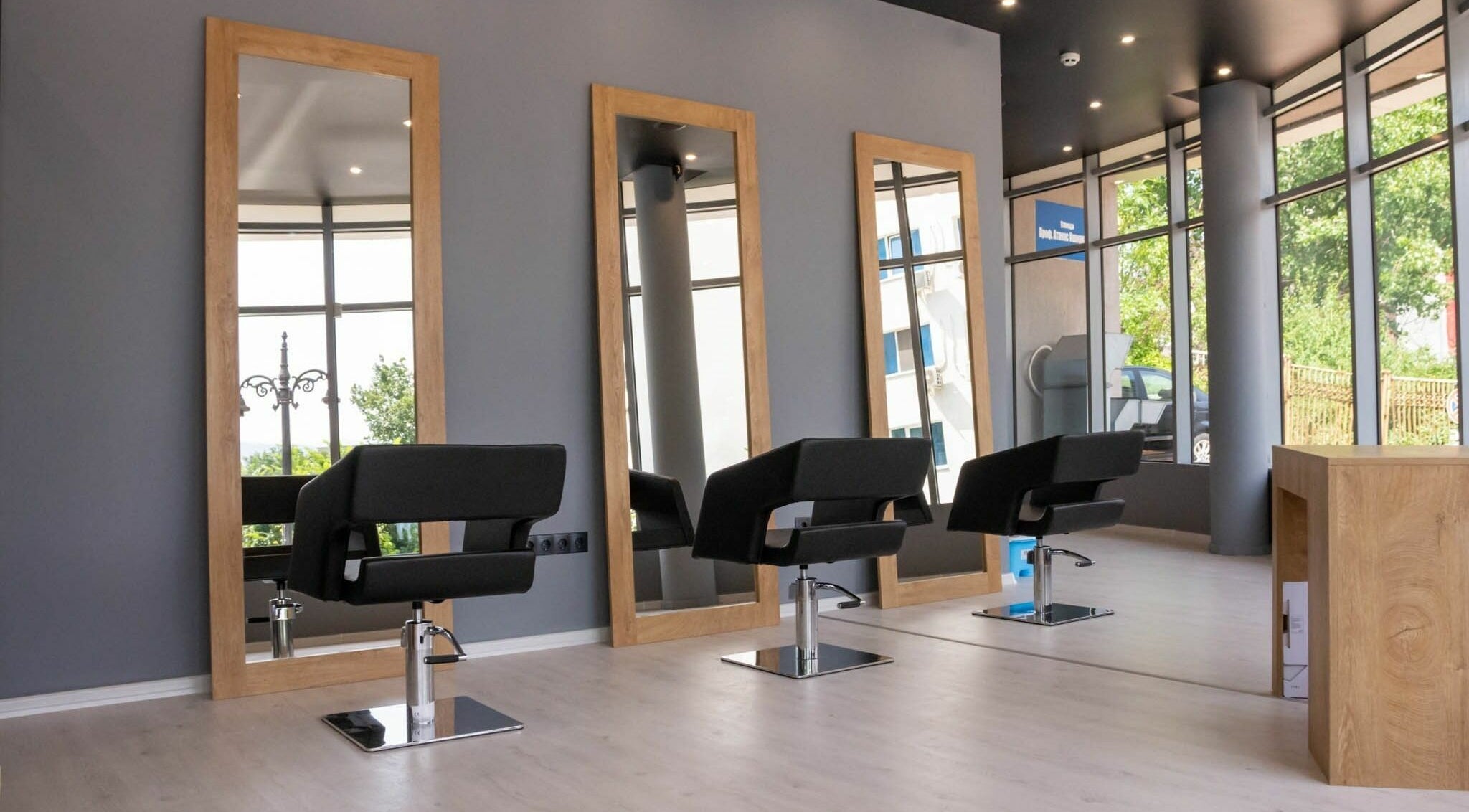 Stylish interior of Salon Inspire, kv. Studentski Grad, София, BG with chic mirrors and seating.