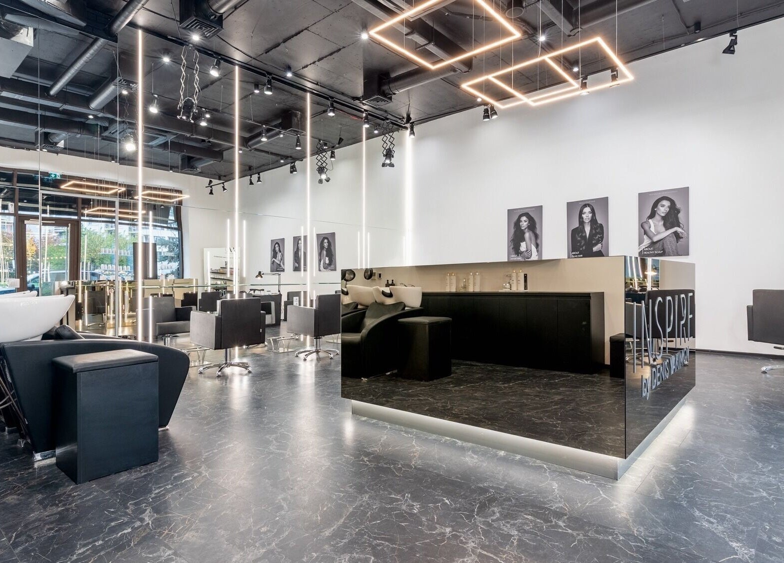 Interior of Salon Inspire kv. Hladilnika Paradise Mall in София, BG featuring modern design and styling stations.