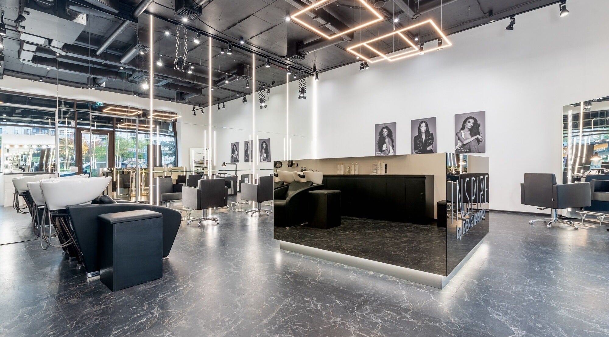 Interior of Salon Inspire kv. Hladilnika Paradise Mall in София, BG featuring modern design and styling stations.