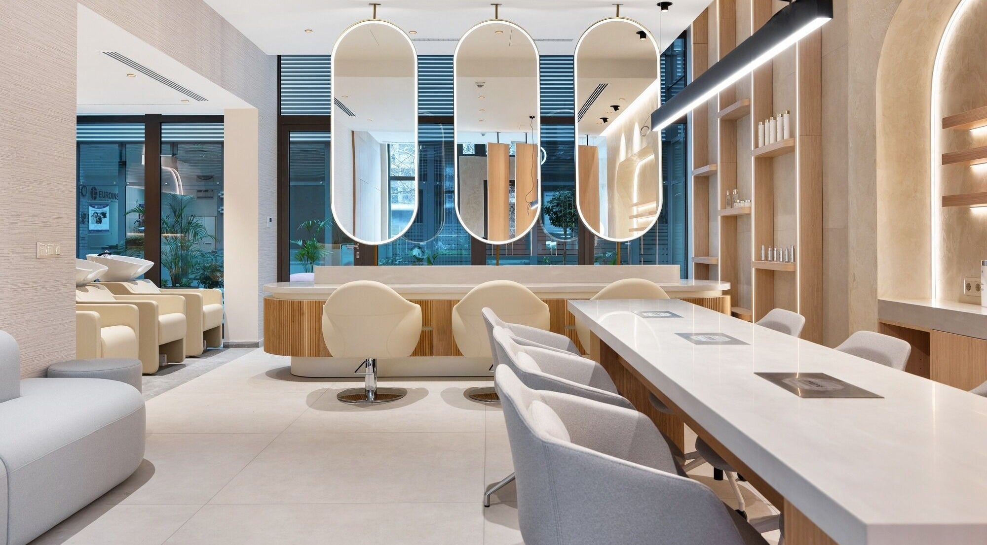 Interior of Salon Inspire, Business Park, Sofia, BG, featuring chic mirrors and stylish seating.