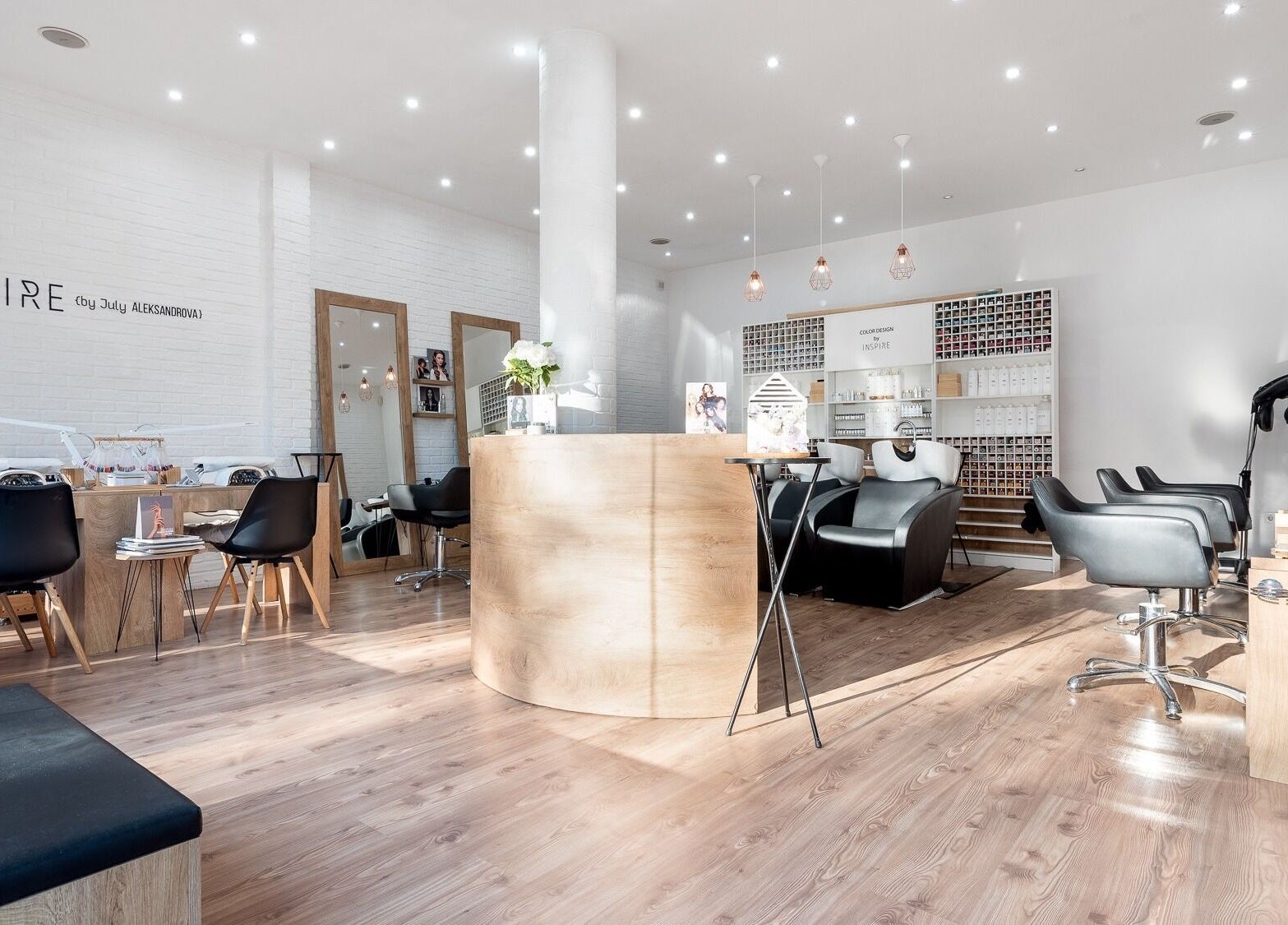 Interior of Salon Inspire, kv. Manastirski livadi, София, BG with modern decor and black salon chairs.