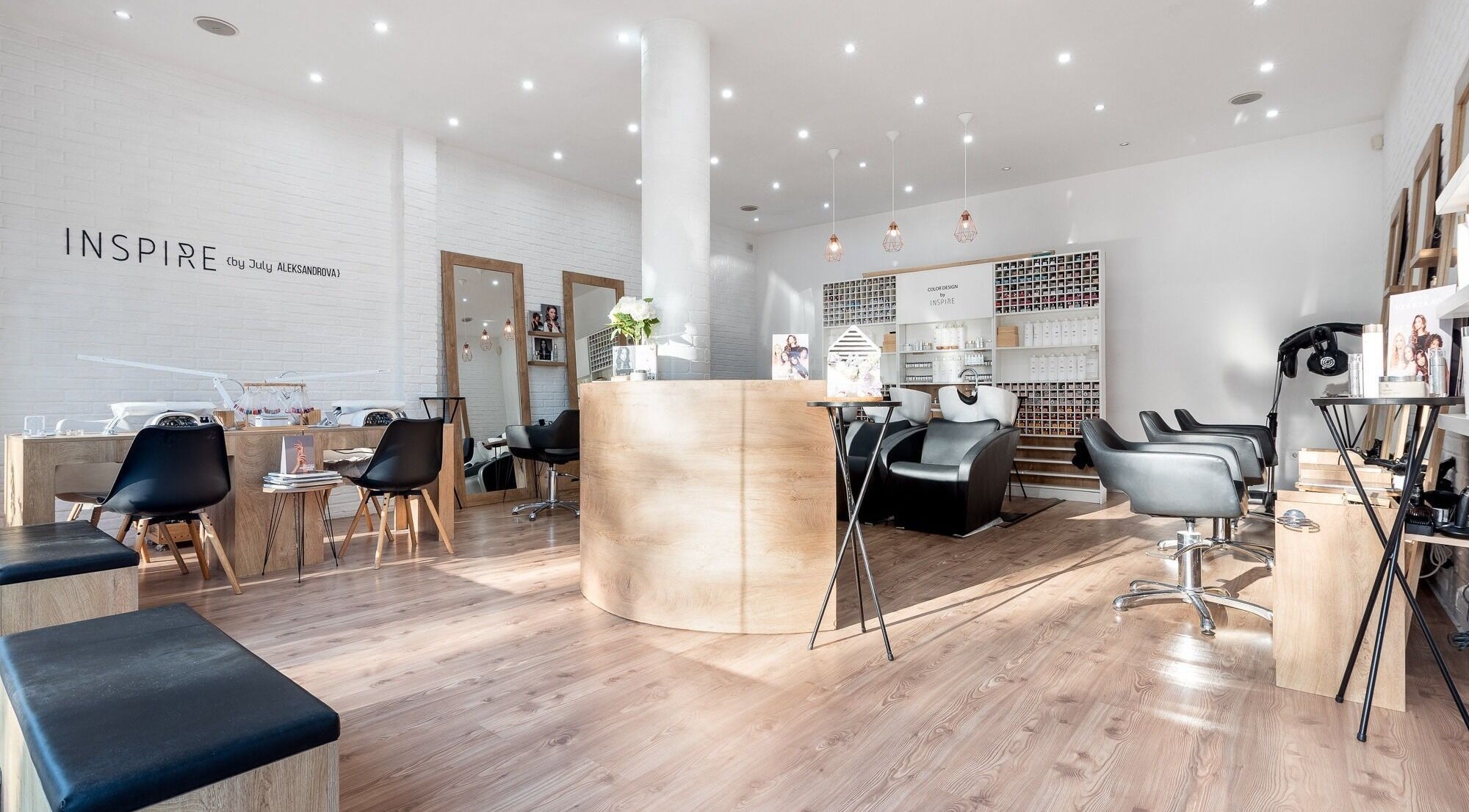 Interior of Salon Inspire, kv. Manastirski livadi, София, BG with modern decor and black salon chairs.