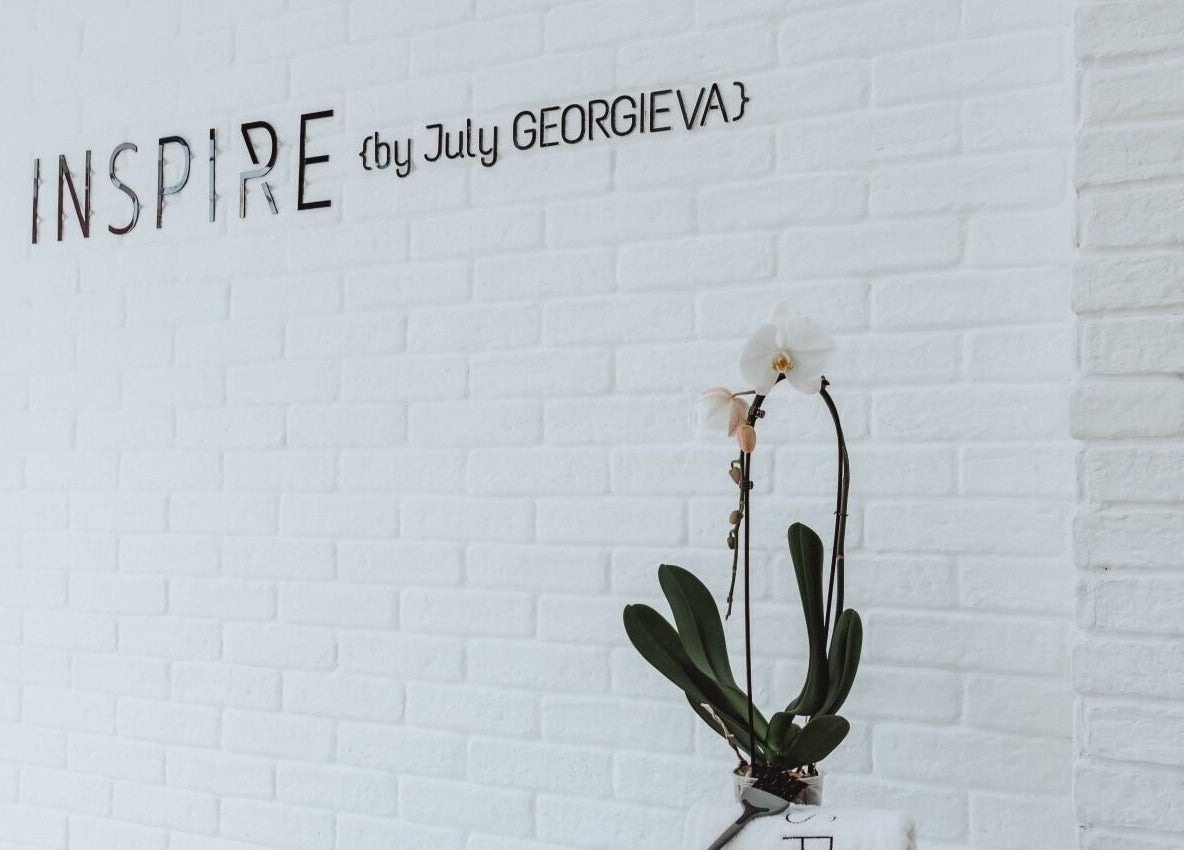 Elegant white brick wall with 'Inspire' signage at Salon Inspire, kv. Manastirski livadi, София, BG.