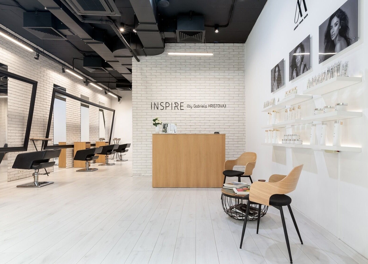 Chic and modern interior of Salon Inspire, kv. Mladost 1, София, BG, showcasing stylish salon chairs and decor.