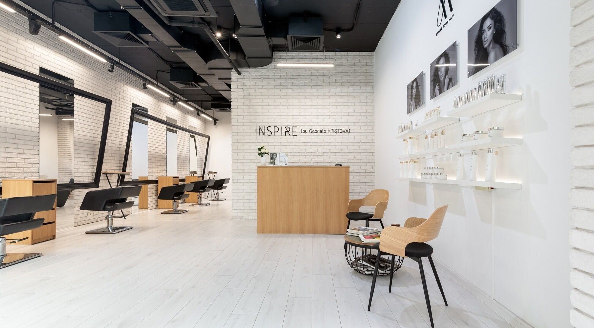 Chic and modern interior of Salon Inspire, kv. Mladost 1, София, BG, showcasing stylish salon chairs and decor.