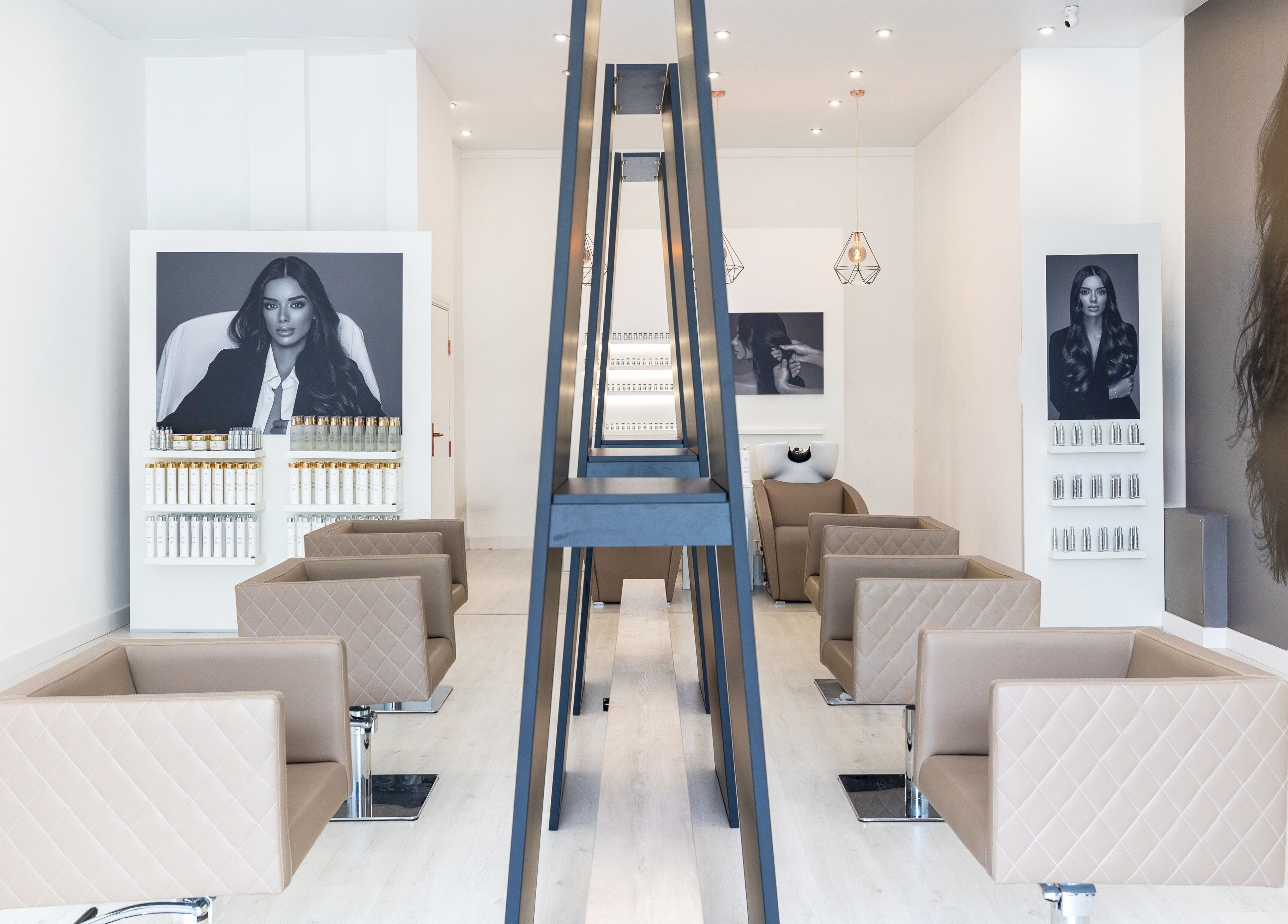 Elegant and modern interior of Salon Inspire, kv. Iztok, София, BG with stylish seating and decor.