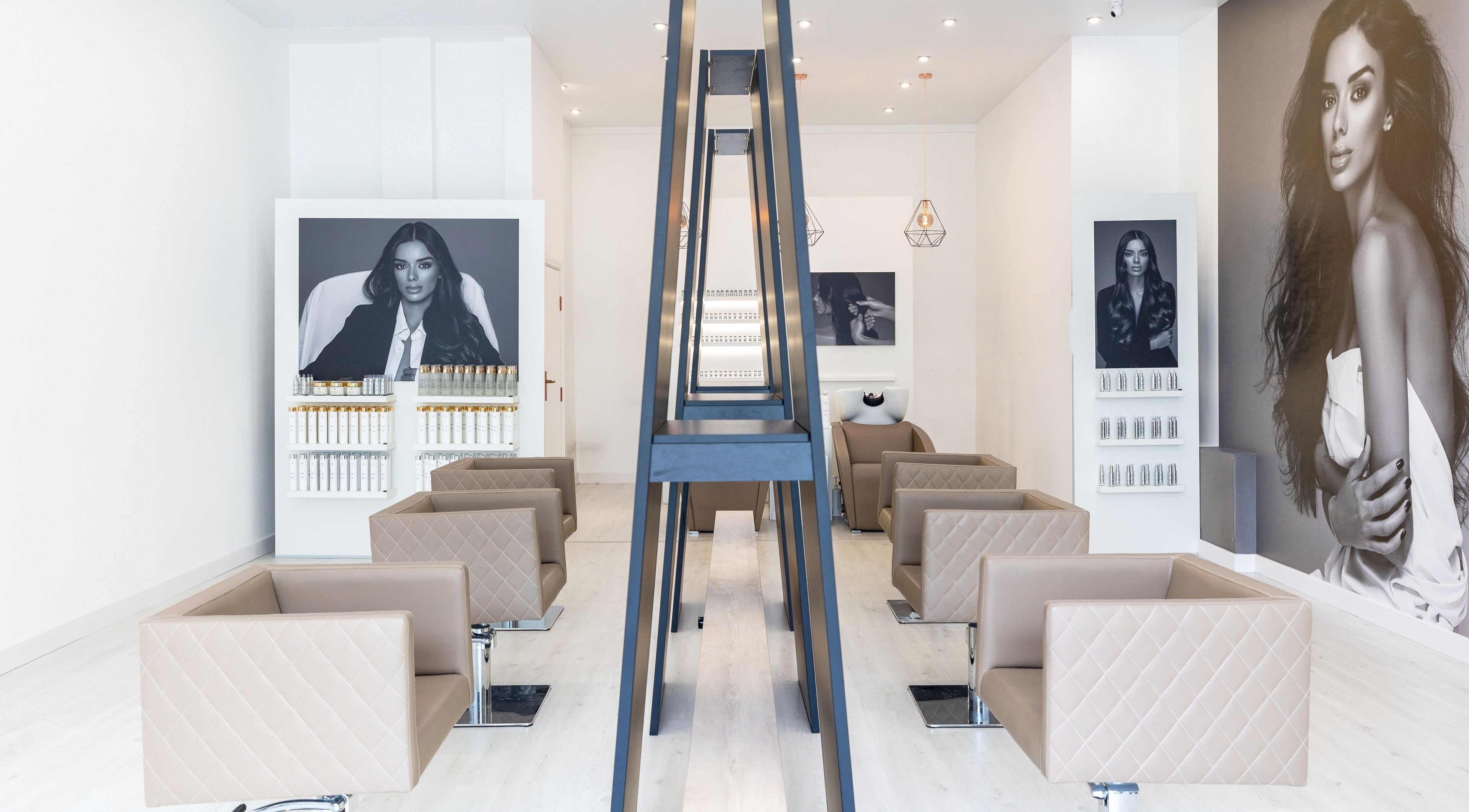 Elegant and modern interior of Salon Inspire, kv. Iztok, София, BG with stylish seating and decor.