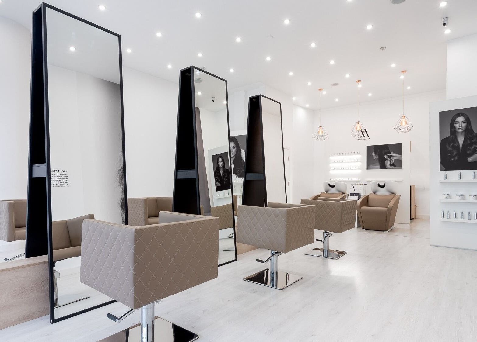 Chic interior of Salon Inspire, kv. Iztok, София, BG showcasing modern styling stations and decor.