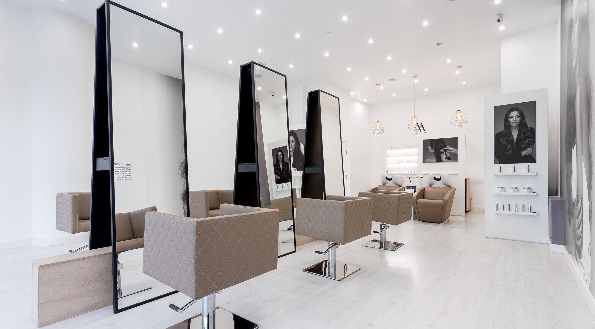 Chic interior of Salon Inspire, kv. Iztok, София, BG showcasing modern styling stations and decor.