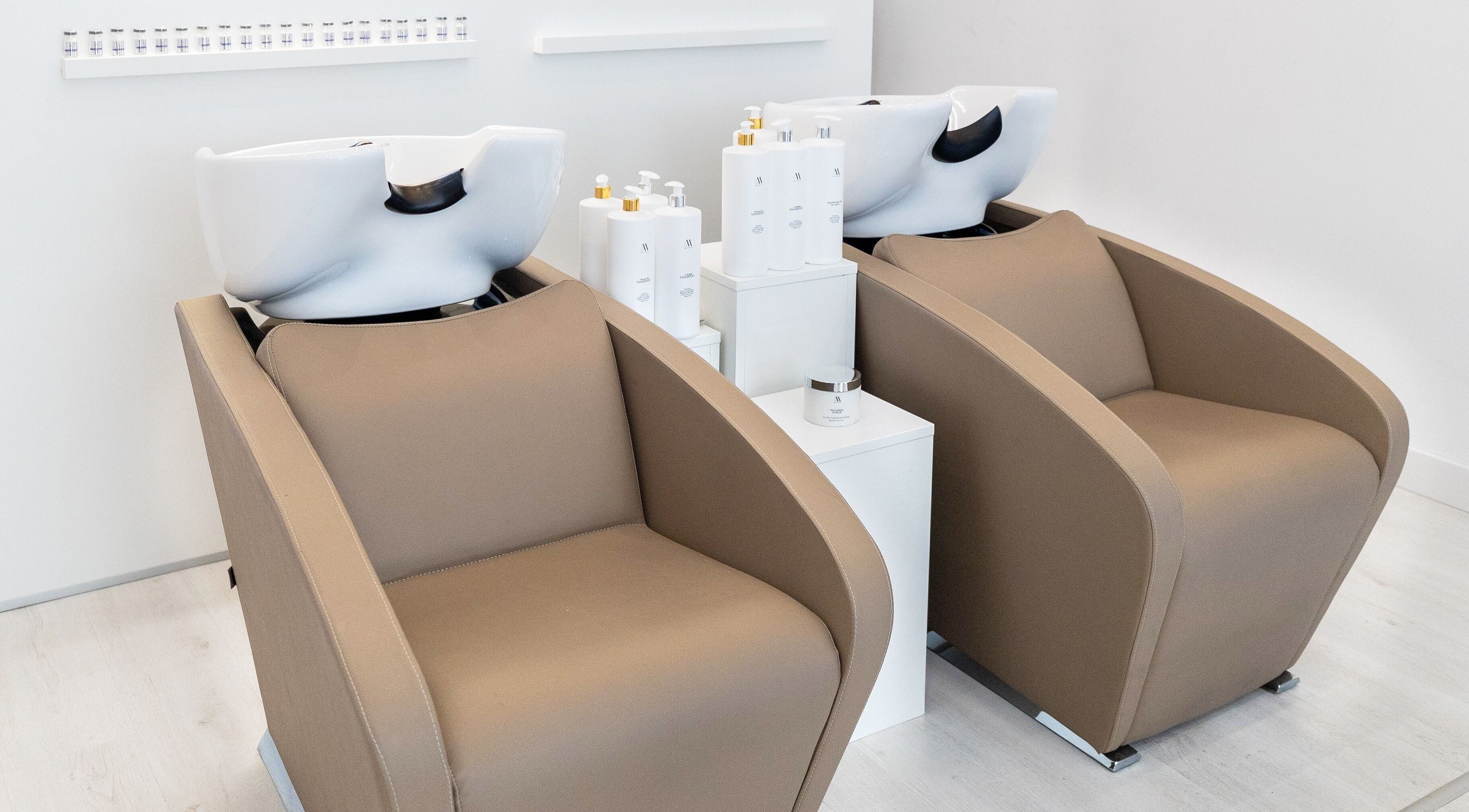 Modern wash stations at Salon Inspire, kv. Iztok, София, BG, offering top-tier hair care services.