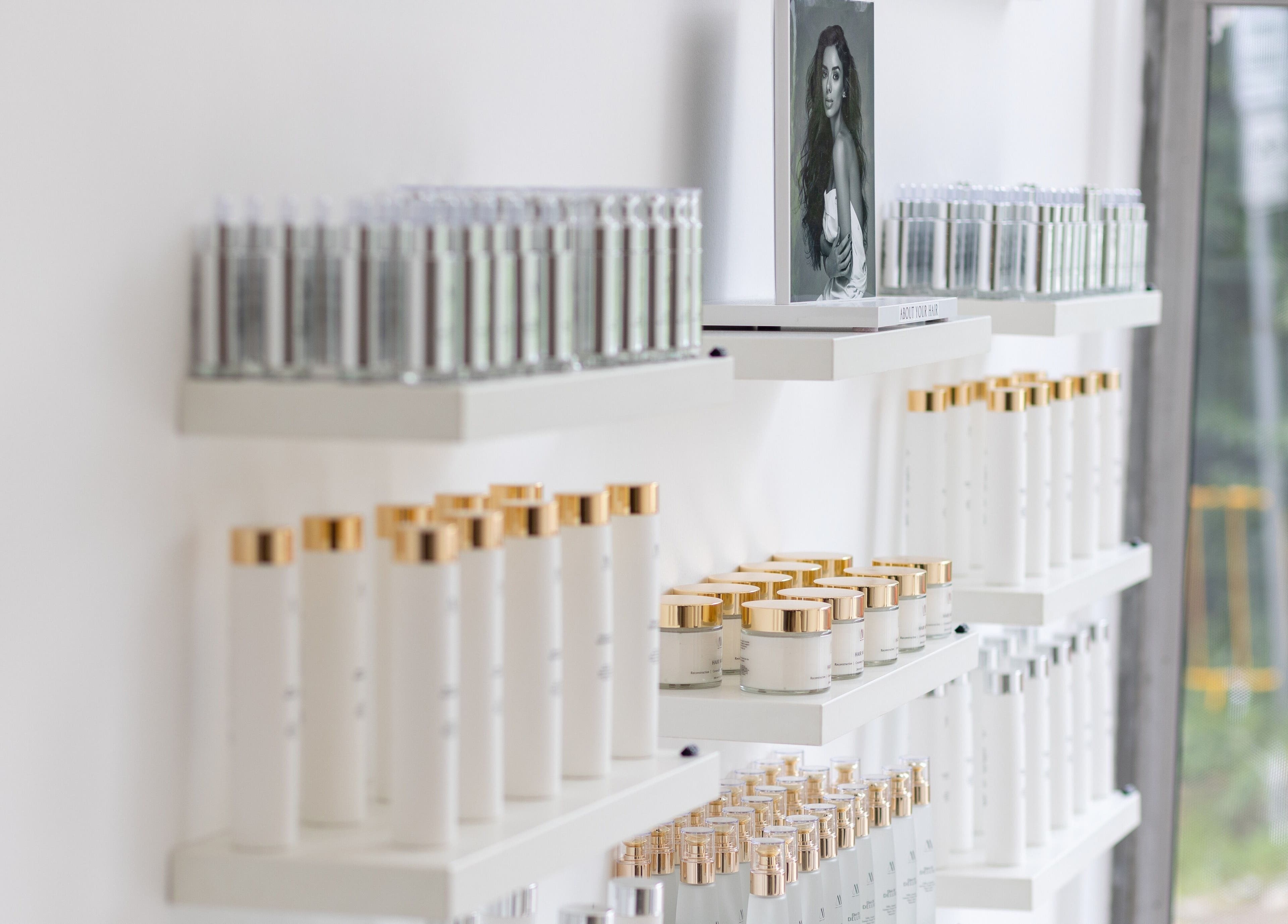 Elegant shelves of beauty products at Salon Inspire, kv. Iztok, София, BG, showcasing premium skincare.