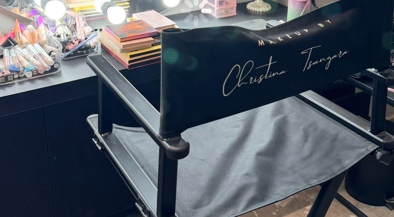 Makeup station at The O Hair and Beauty, Limassol, featuring professional chair and cosmetics under bright lights.