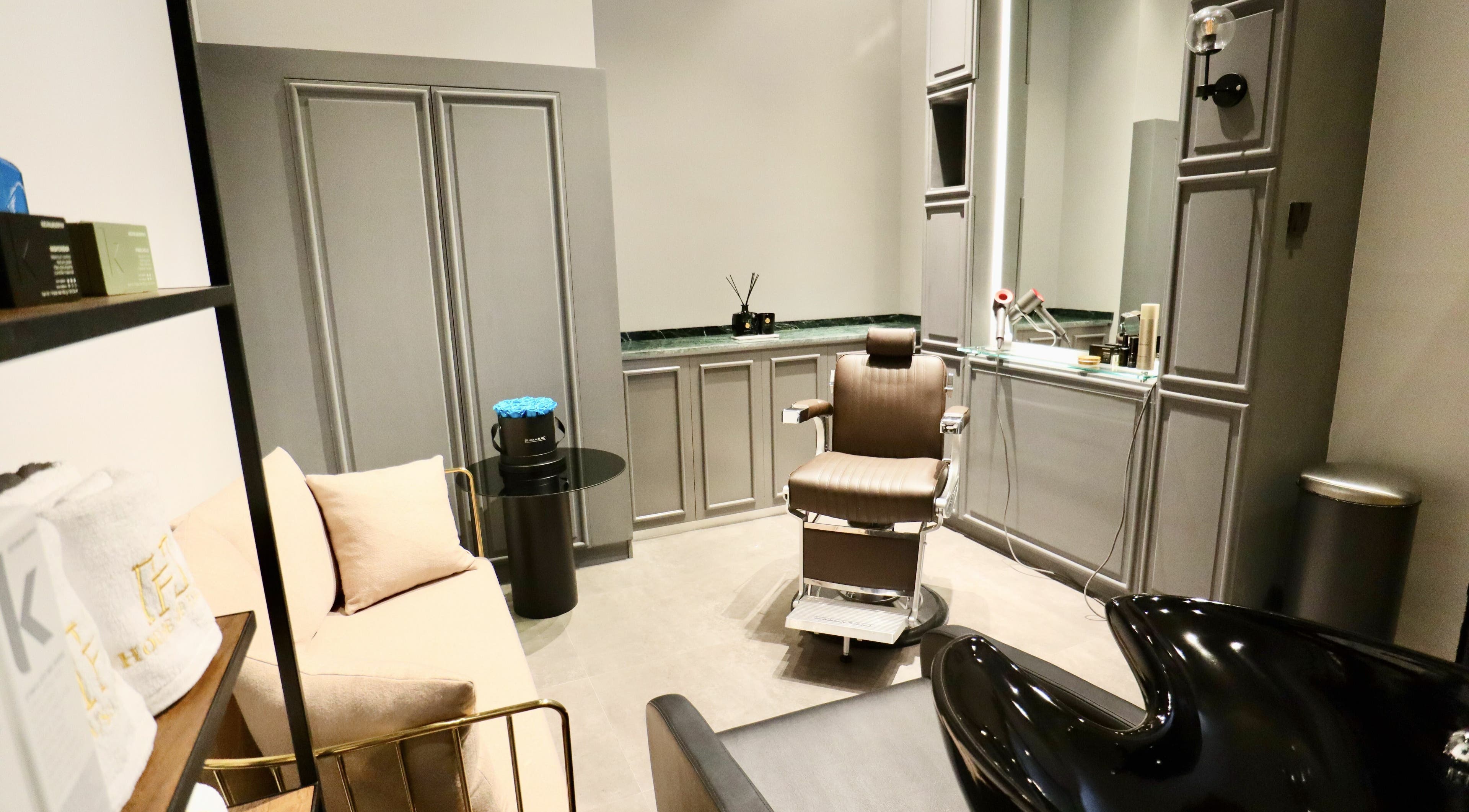 Luxurious salon chair and decor at House of Fade, Dubai, AE, offering premium grooming services.