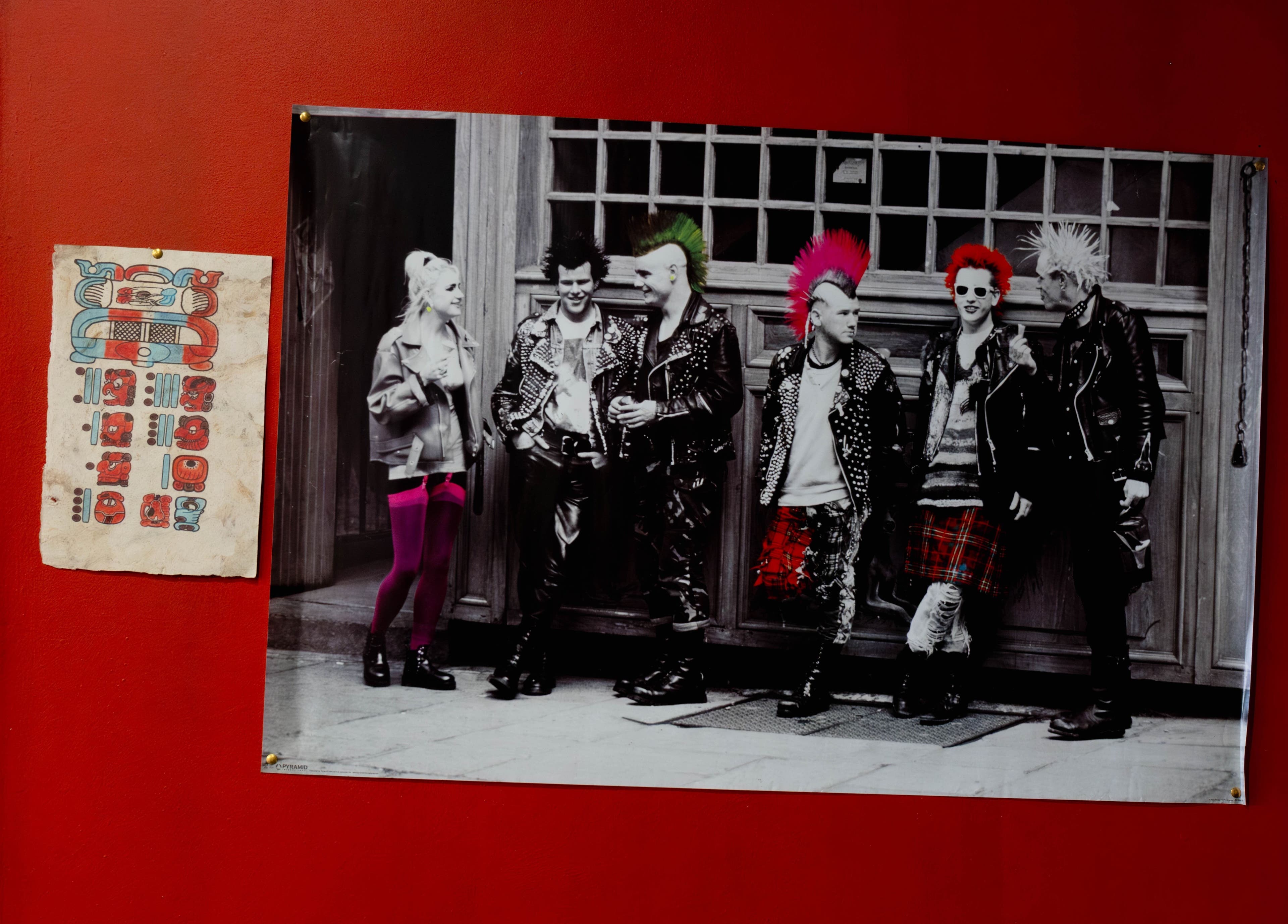 Vibrant punk rock artwork on a red wall at Unparalleled 145, London, England, GB.