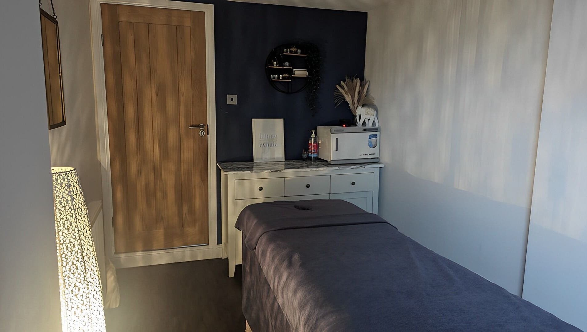 Calming treatment room at Sensational Beauty, Mirfield, England, GB, featuring a massage table and soft lighting.