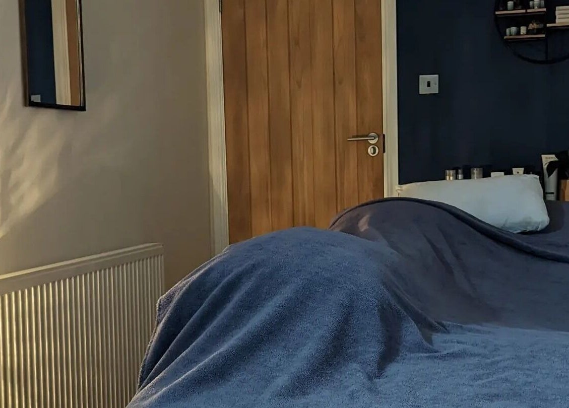 Relaxing massage room at Sensational Beauty in Mirfield, England, GB with cozy lighting and soothing decor.