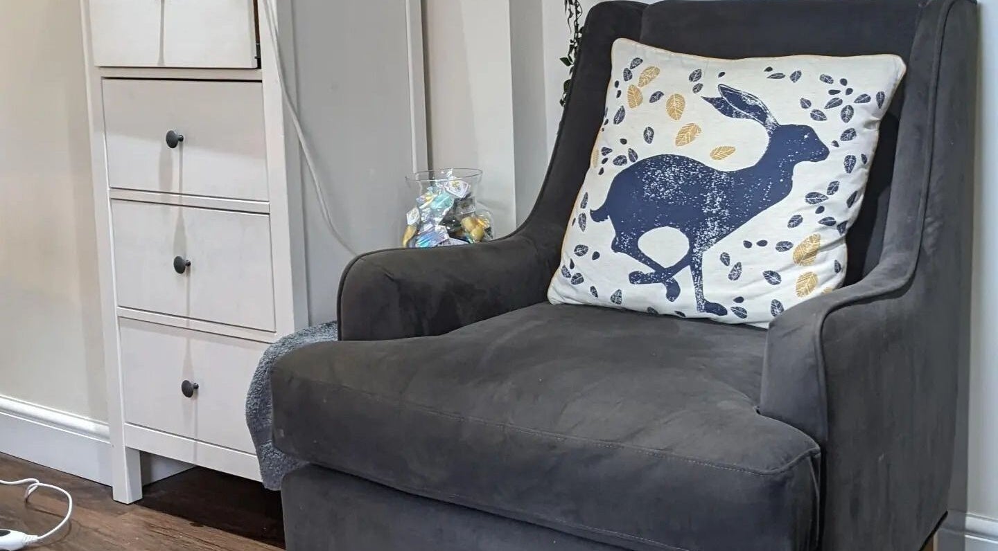 Cozy armchair with stylish cushion in Sensational Beauty, Mirfield, England, GB.