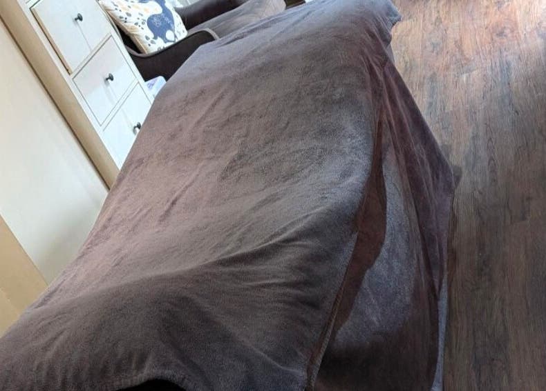 Cozy treatment room at Sensational Beauty, Mirfield, England, GB with plush bed and serene ambiance.