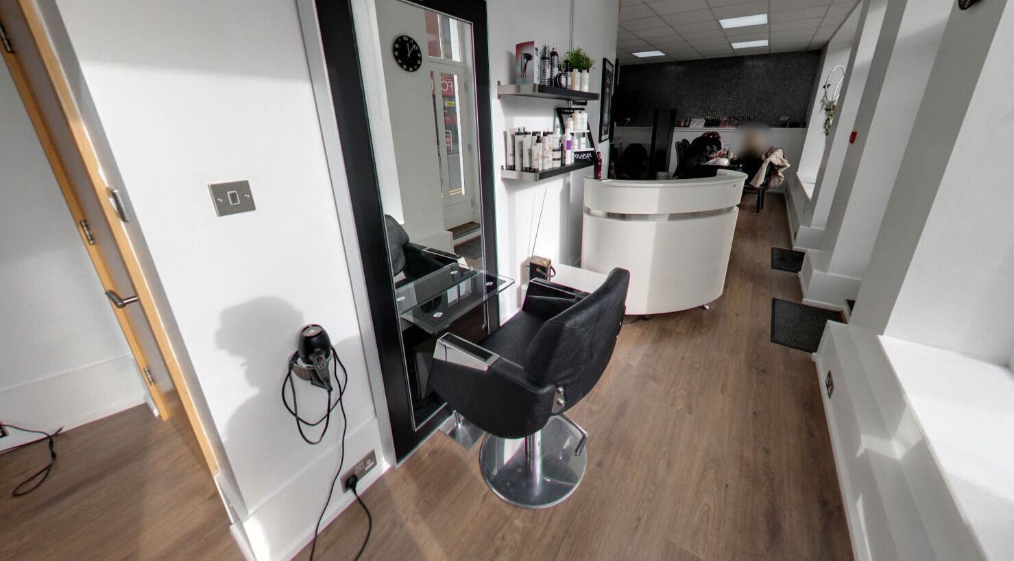 Sleek black salon chair and mirror at Vie Nails and Beauty, Lichfield, England, GB. Modern salon design.