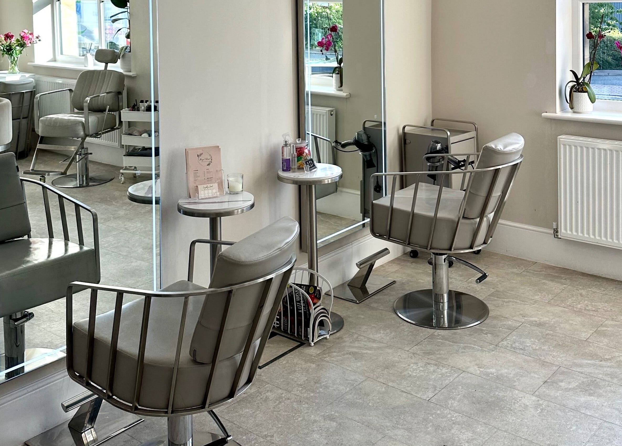 Elegant salon interior at Lashtoxx in Halifax, England with stylish chairs and mirrors.