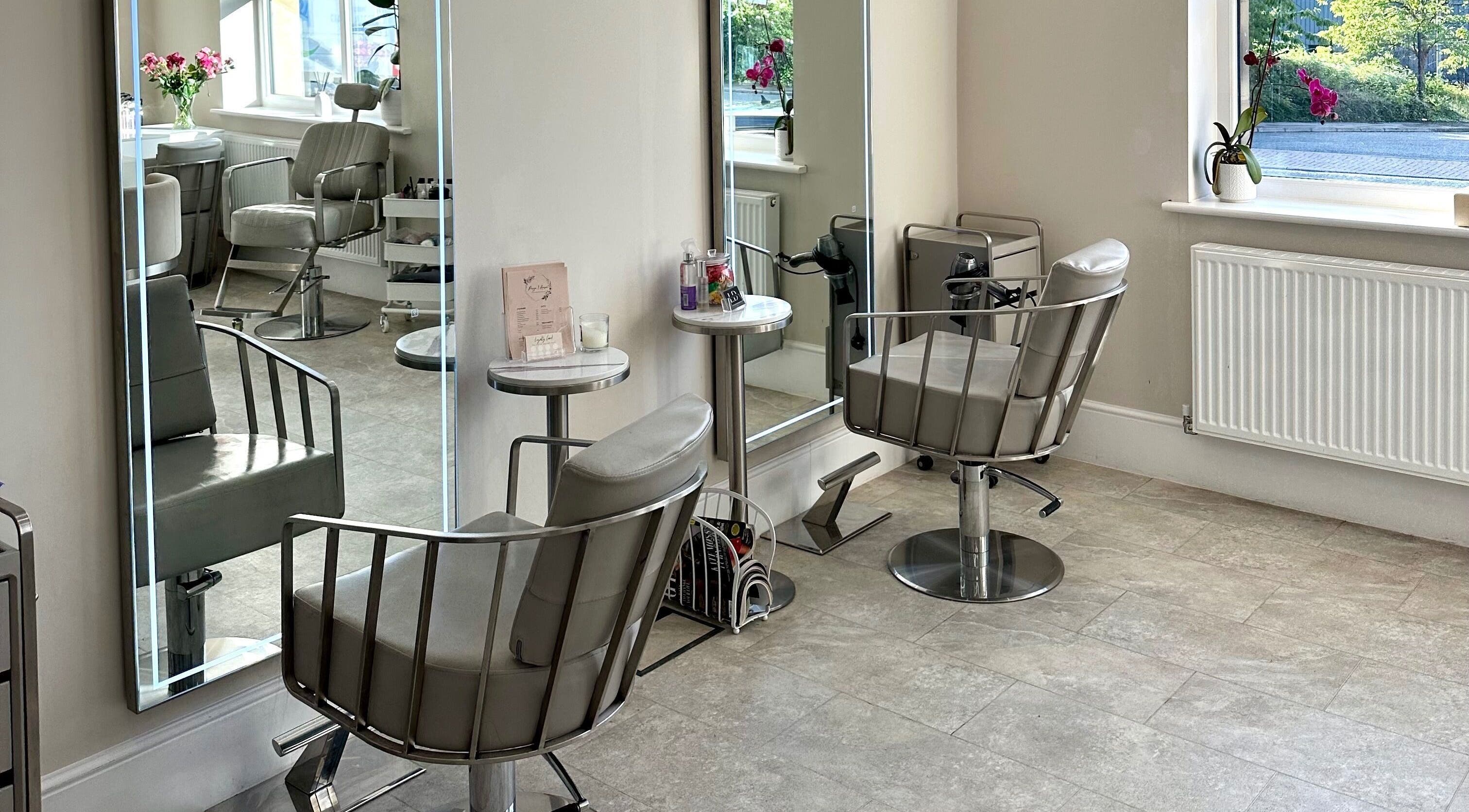 Elegant salon interior at Lashtoxx in Halifax, England with stylish chairs and mirrors.