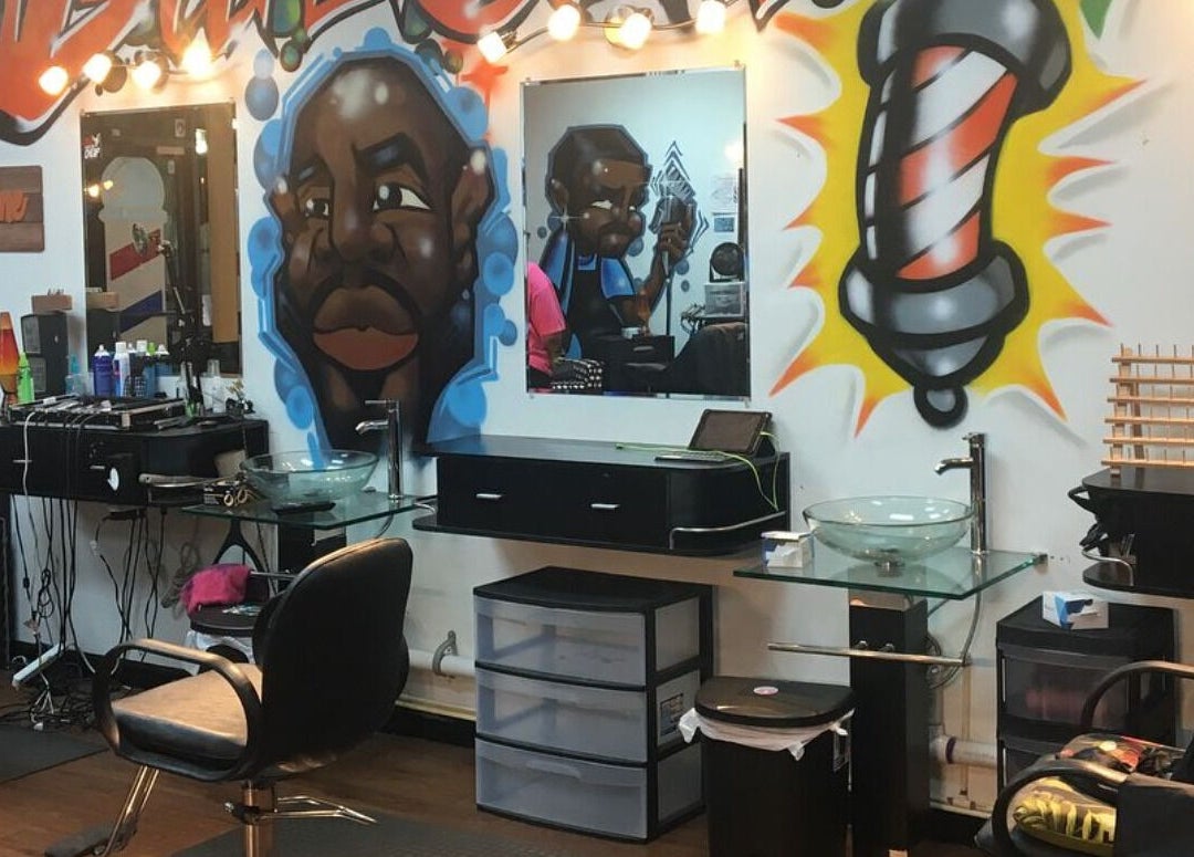Vibrant interior with graffiti art at Perfect Blendz Barber Lounge, Jonesboro, Georgia, US.