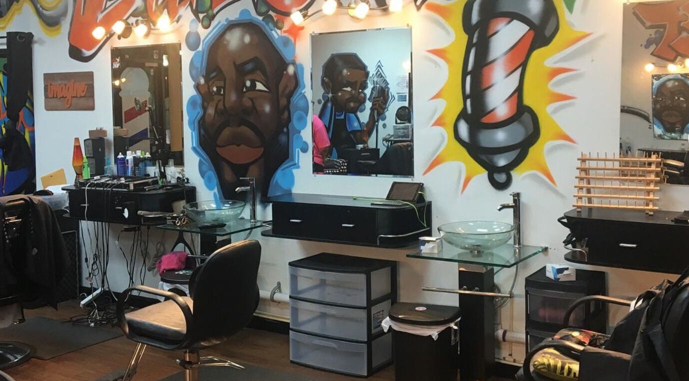 Vibrant interior with graffiti art at Perfect Blendz Barber Lounge, Jonesboro, Georgia, US.