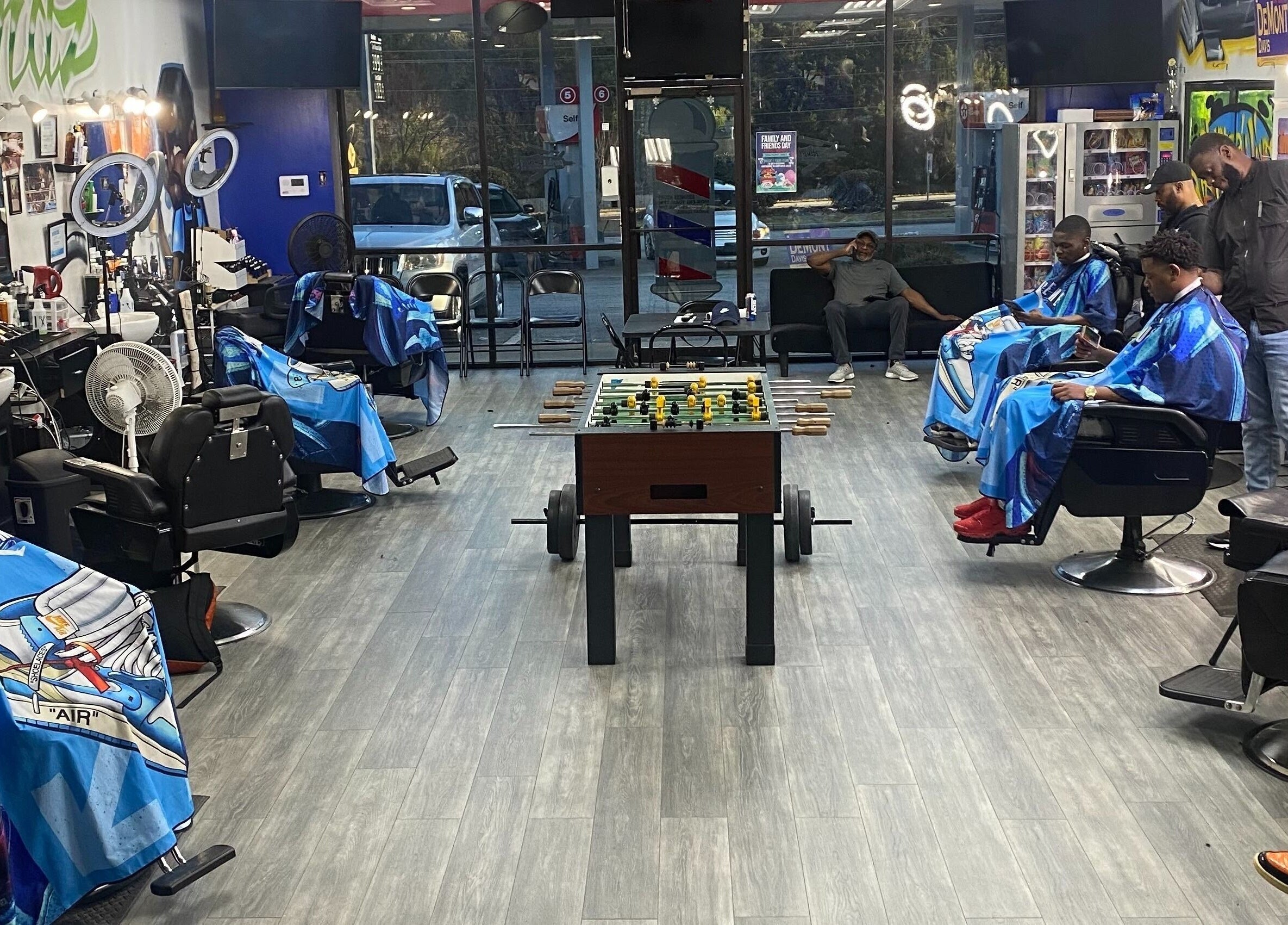 Interior of Perfect Blendz Barber Lounge in Jonesboro, Georgia, US showcasing barber chairs and foosball table.