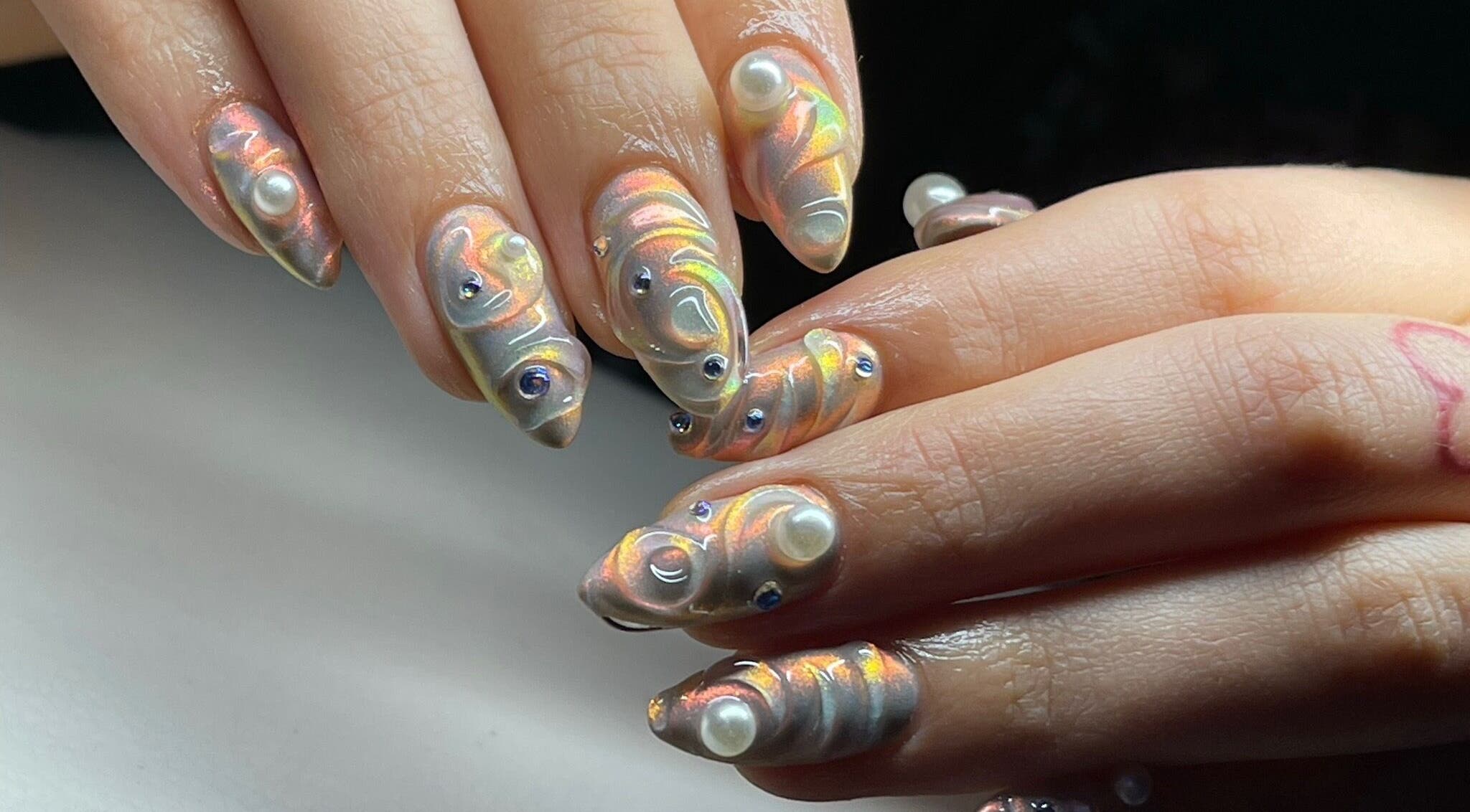 Intricate pearlescent nail art with gemstones at Good Gal Beauty, Vancouver, British Columbia, CA.