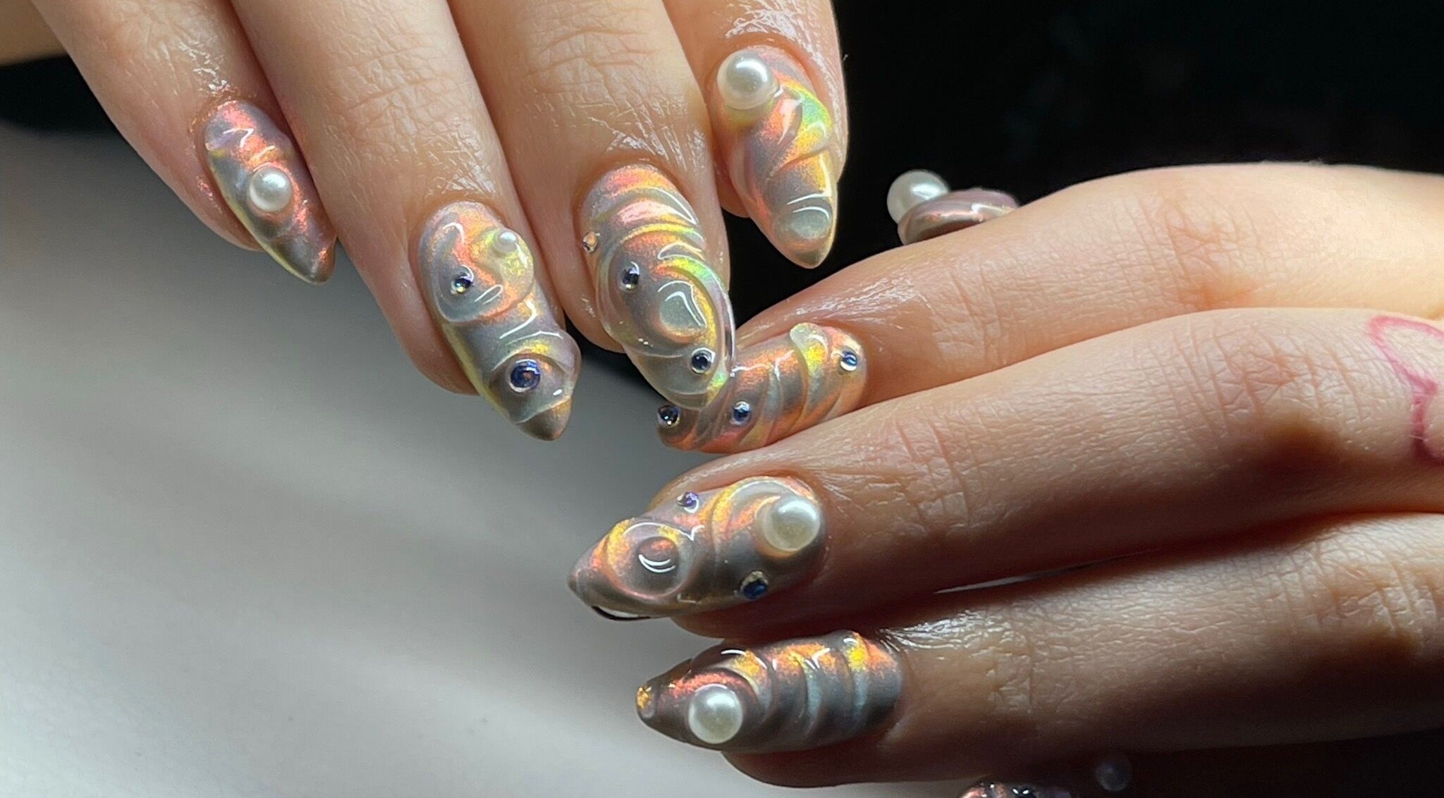 Intricate pearlescent nail art with gemstones at Good Gal Beauty, Vancouver, British Columbia, CA.