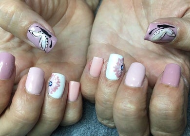 Manicured nails with floral design at Skin Advanced Beauty Treatments in Edenvale, Gauteng, ZA.