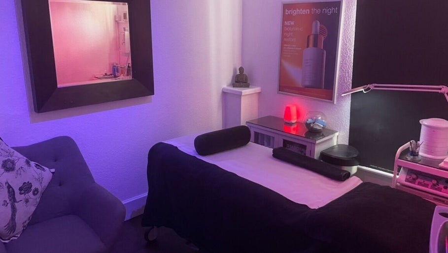 Serene spa room at Vanity Case, Crewe, England, GB, with calming lighting and a comfortable massage table.