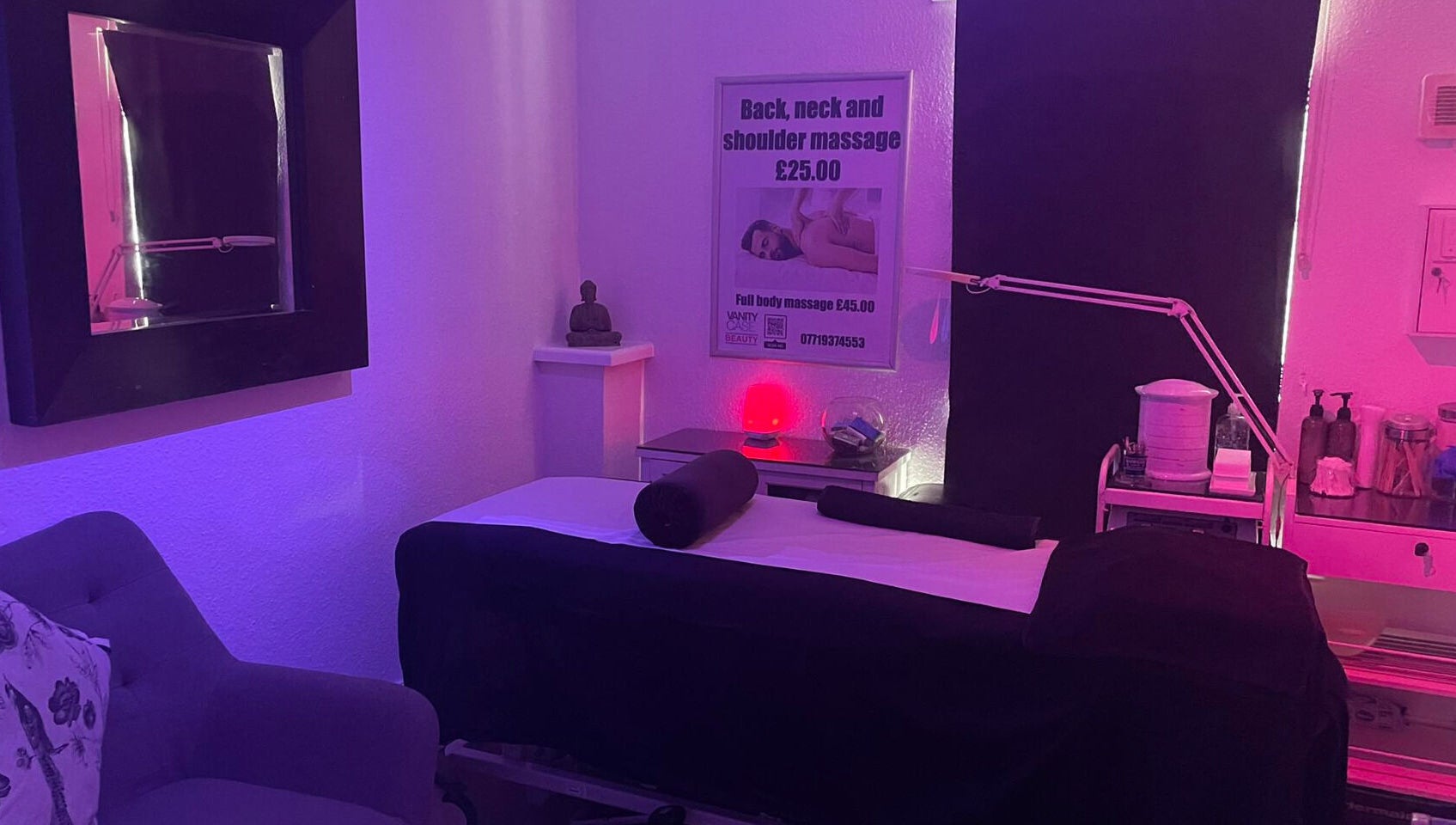 Relaxing massage room at Vanity Case in Crewe, England, GB with serene lighting and cozy setup.