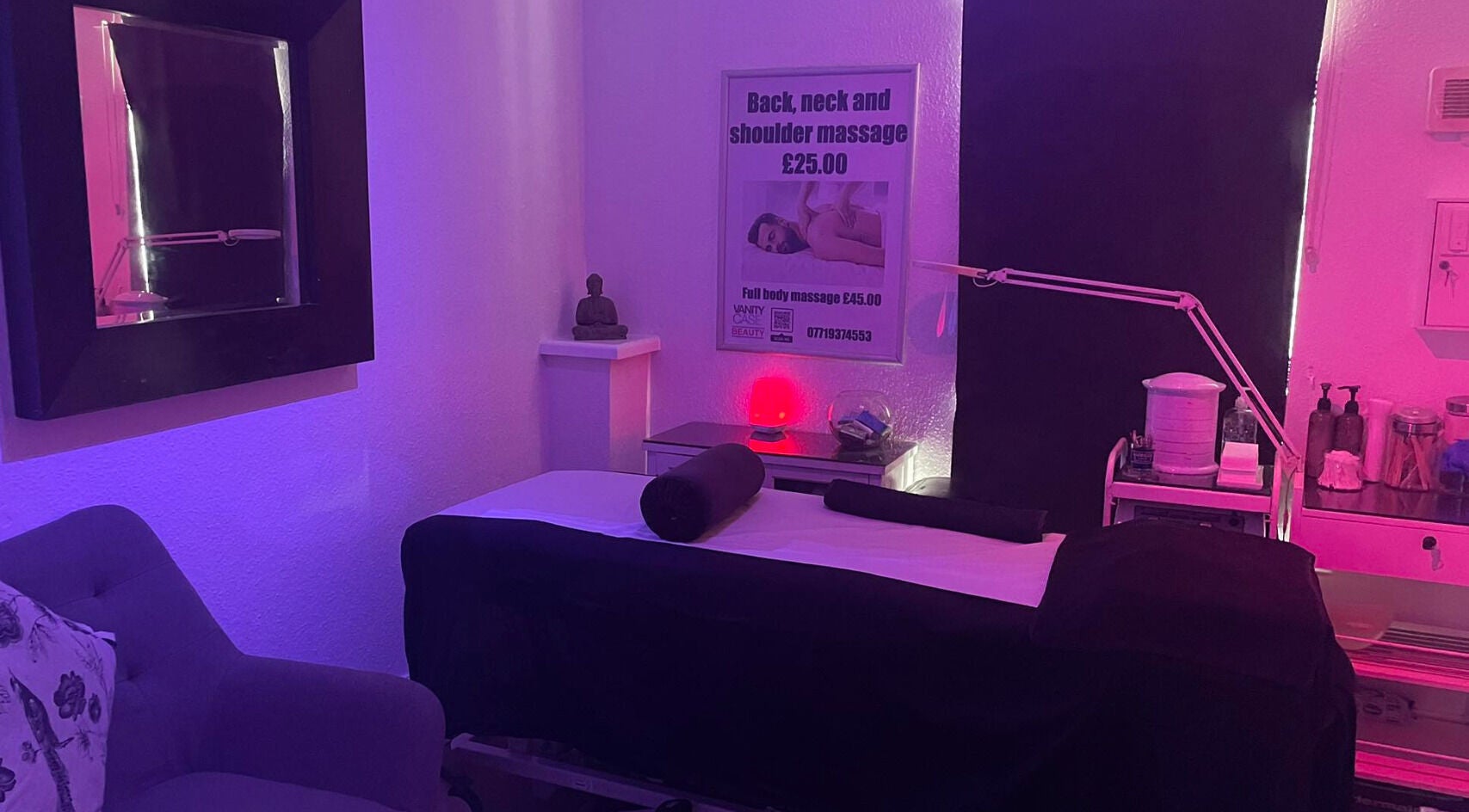 Relaxing massage room at Vanity Case in Crewe, England, GB with serene lighting and cozy setup.