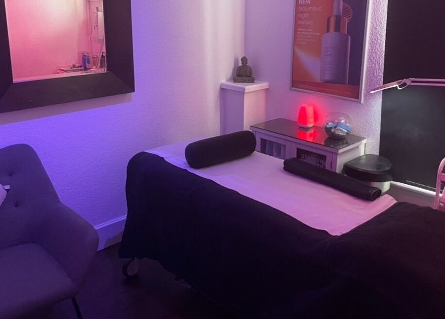 Tranquil massage room at Vanity Case, Crewe, England, GB with soothing lighting and plush décor.