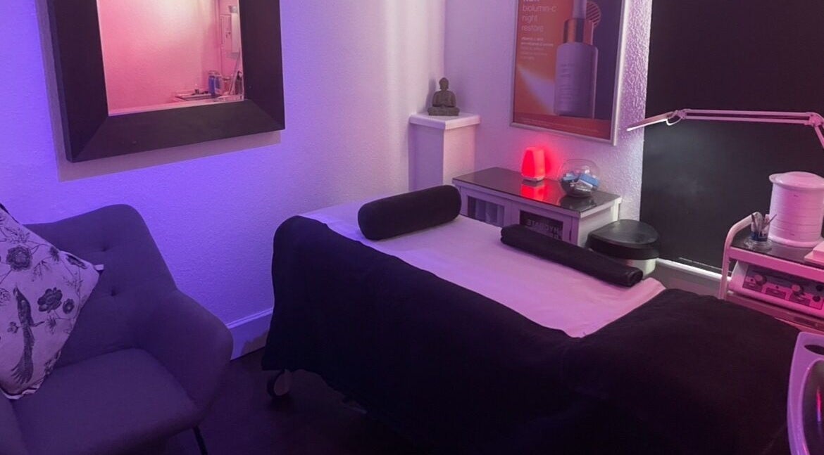 Tranquil massage room at Vanity Case, Crewe, England, GB with soothing lighting and plush décor.