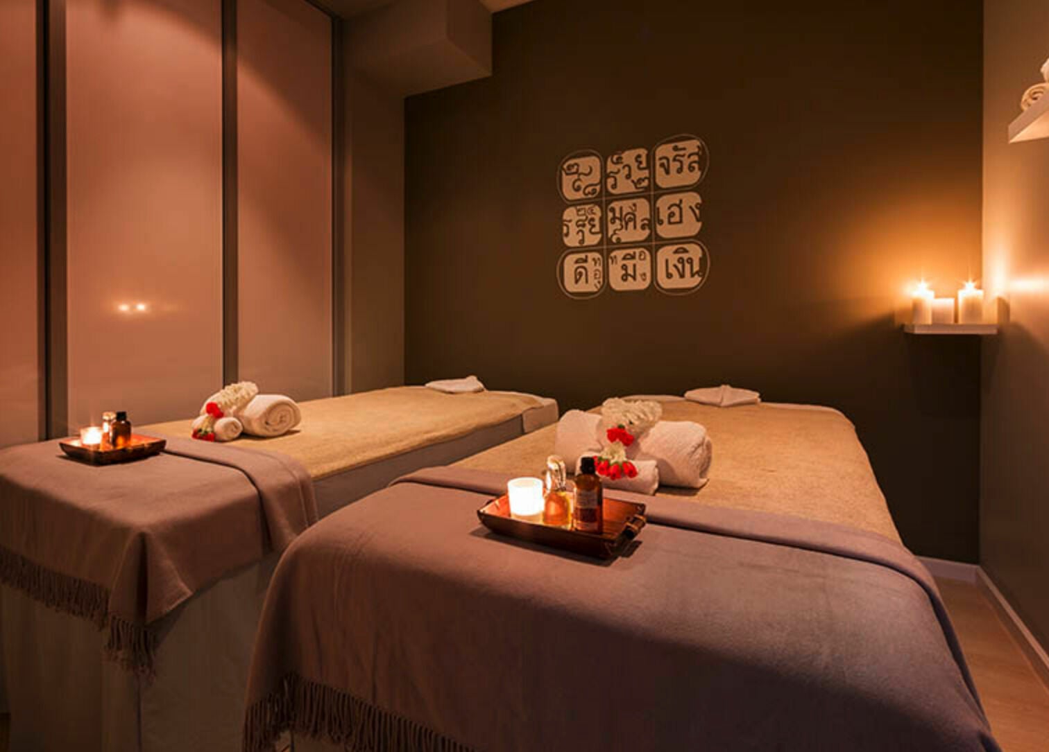 Relaxing massage room at Urban Fusion Massage and Day Spa, Harrison, ACT, AU with candles and warm lighting.