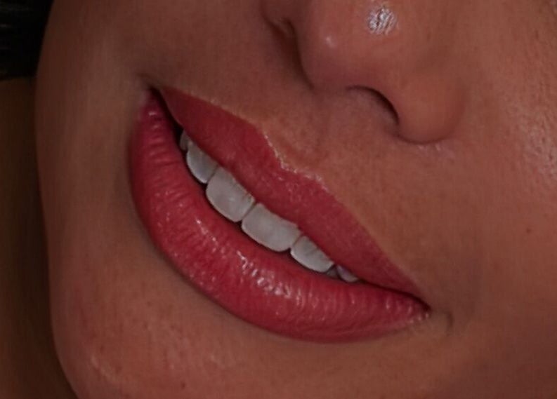 Close-up of a woman's smile with vibrant lips at Blink Lab Studios, Singapore, Singapore, SG.