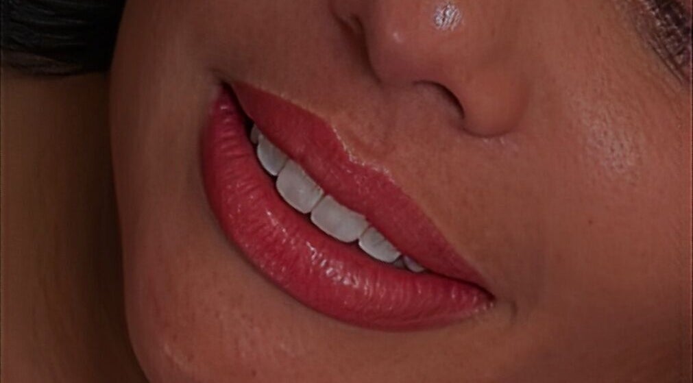 Close-up of a woman's smile with vibrant lips at Blink Lab Studios, Singapore, Singapore, SG.