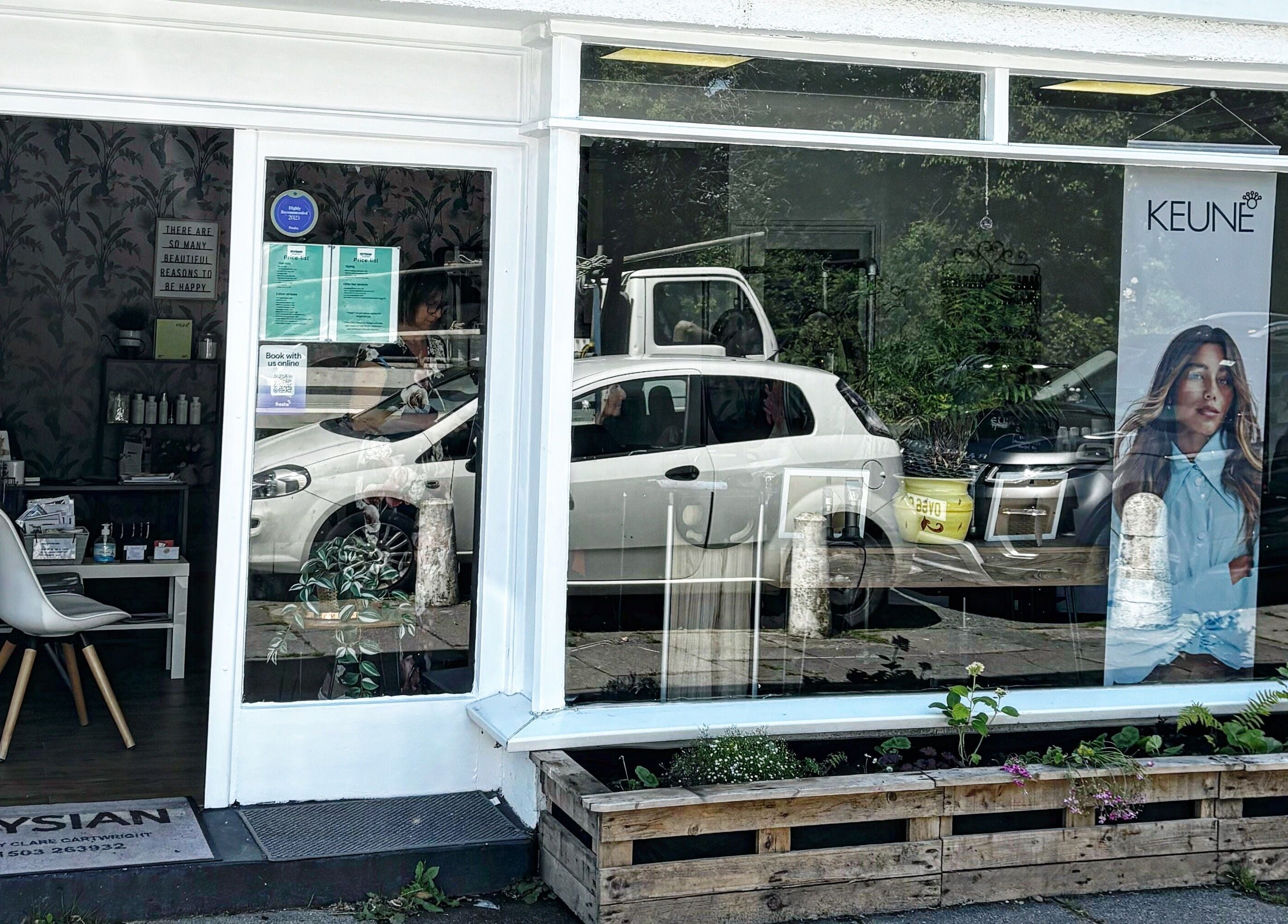 Street view of Elysian Hair in Looe, Cornwall, showcasing a modern salon facade in Looe, England, GB.