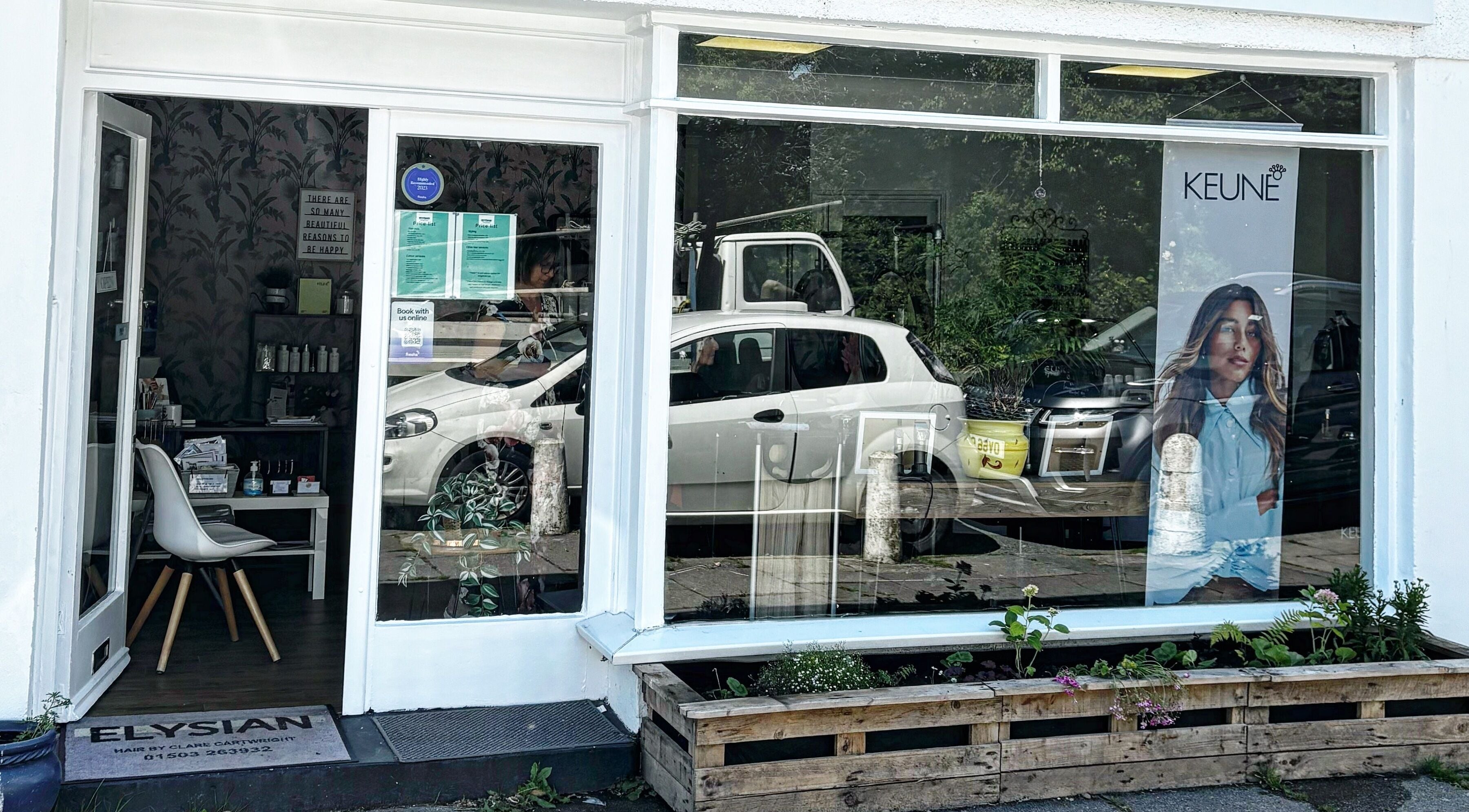 Street view of Elysian Hair in Looe, Cornwall, showcasing a modern salon facade in Looe, England, GB.