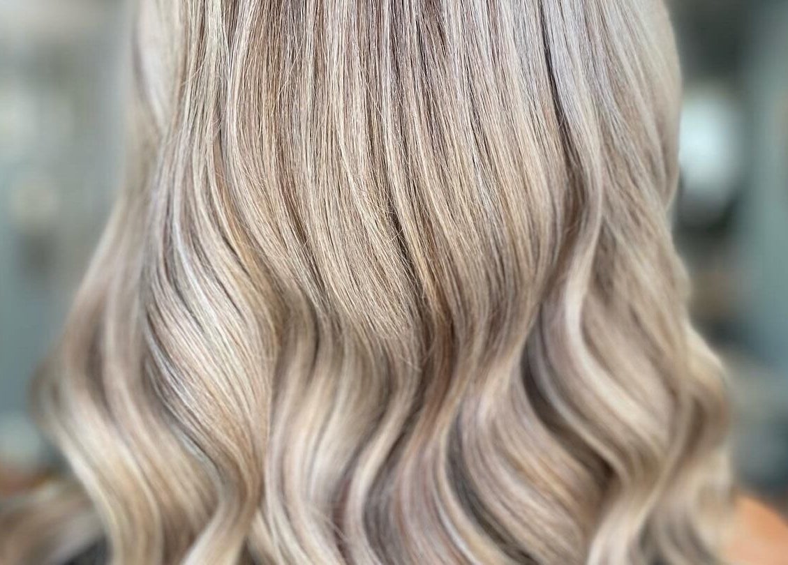 Beautiful wavy blonde hair styled at Elysian Hair - Looe, Cornwall. Visit us in Looe, England, GB for perfect hair.